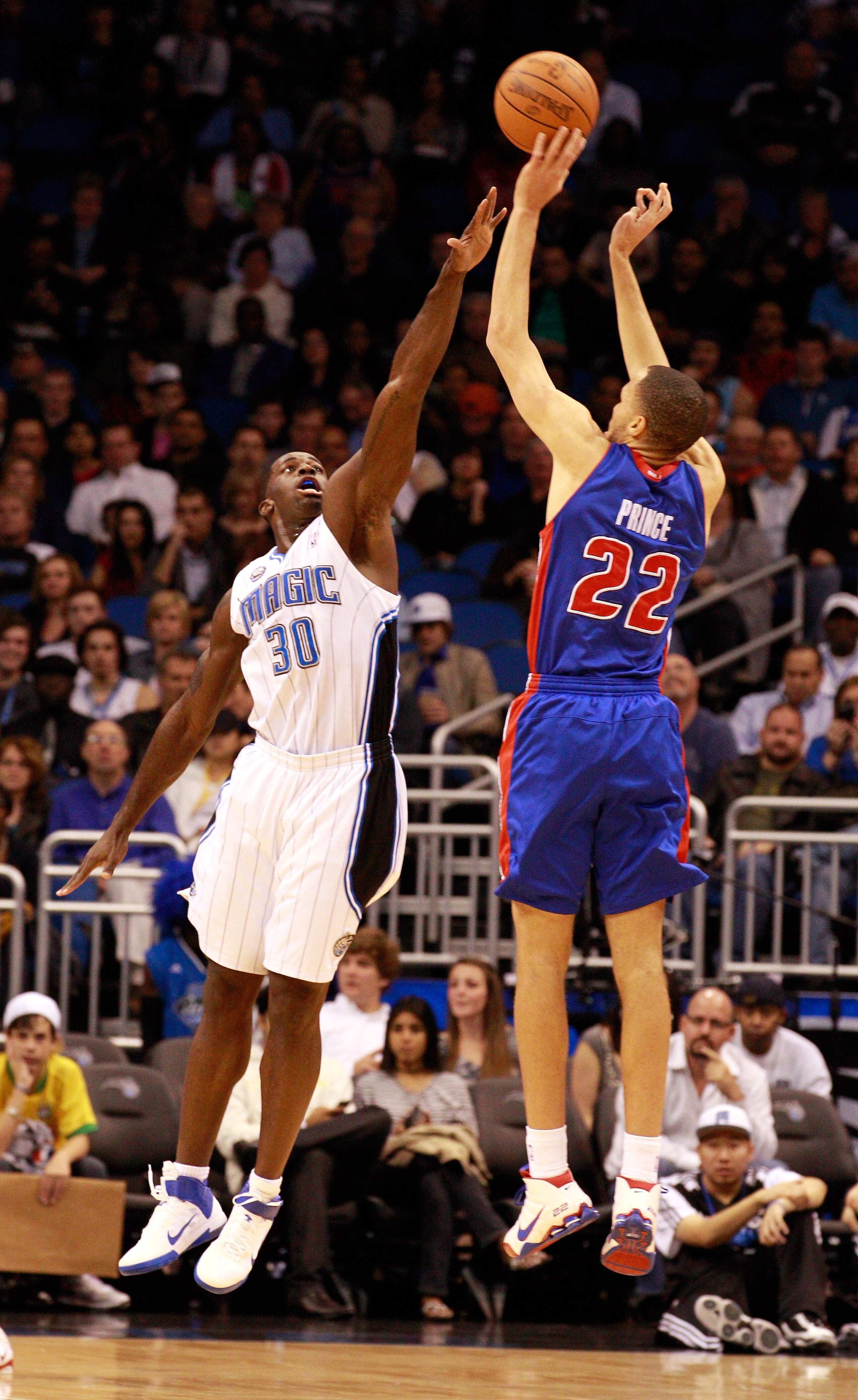ORLANDO, FL - JANUARY 24:  Tayshaun Prince #22 of the Detroit Pistons attempts a shot over Brandon Bass #30 of the Orlando Magic during the game at Amway Arena on January 24, 2011 in Orlando, Florida.  NOTE TO USER: User expressly acknowledges and agrees