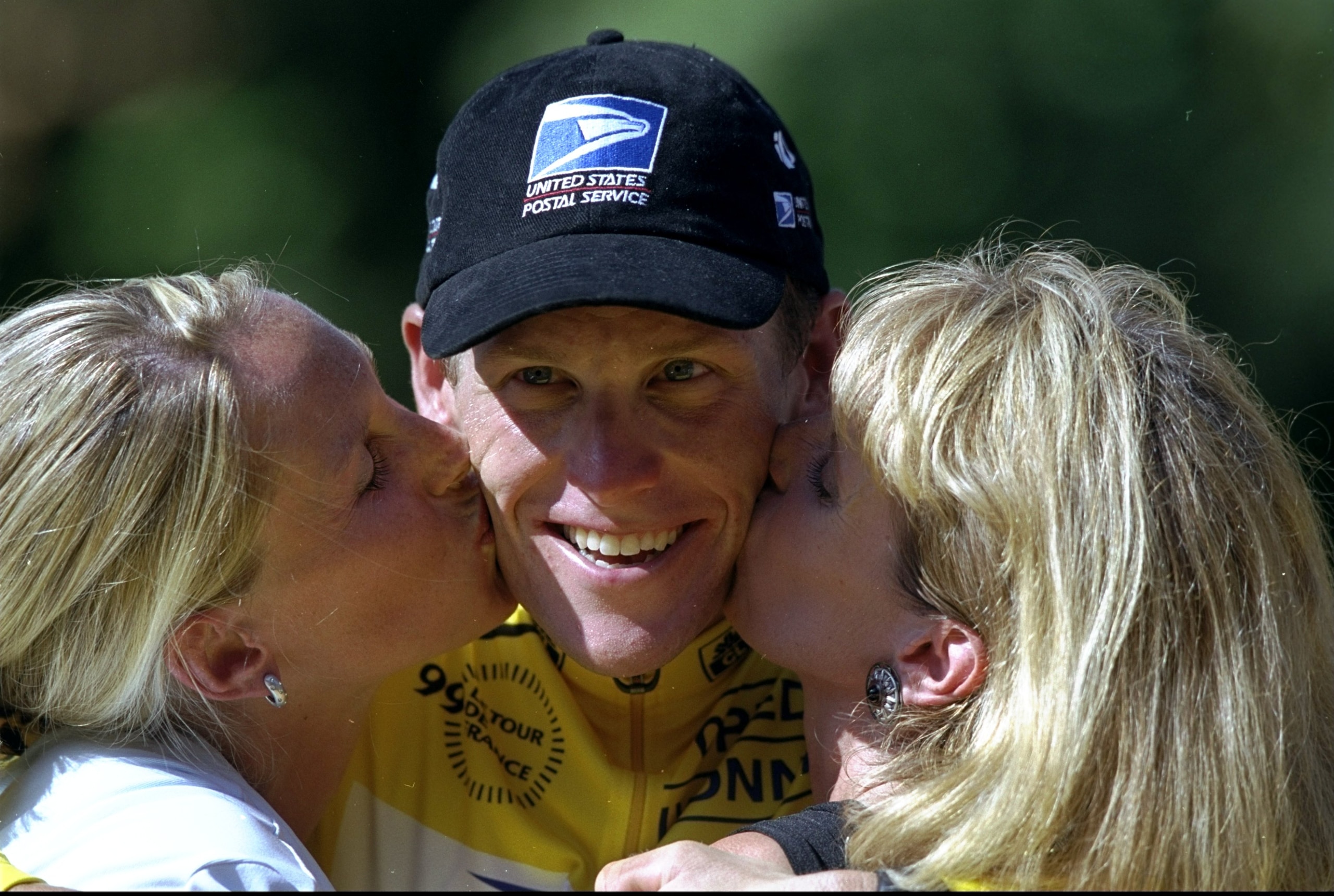 25 Jul 1999: Lance Armstrong of USA and the US Postal team is kissed by first wife Kristen and mother Linda after winning the 1999 Tour de France on stage 20 between Arpajon and Paris, France. \ Mandatory Credit: Tom Able-Green /Allsport 25 Jul 1999: Lance Armstrong of USA and the US Postal team is kissed by first wife Kristen and mother Linda after winning the 1999 Tour de France on stage 20 between Arpajon and Paris, France. \ Mandatory Credit: Tom Able-Green /Allsport