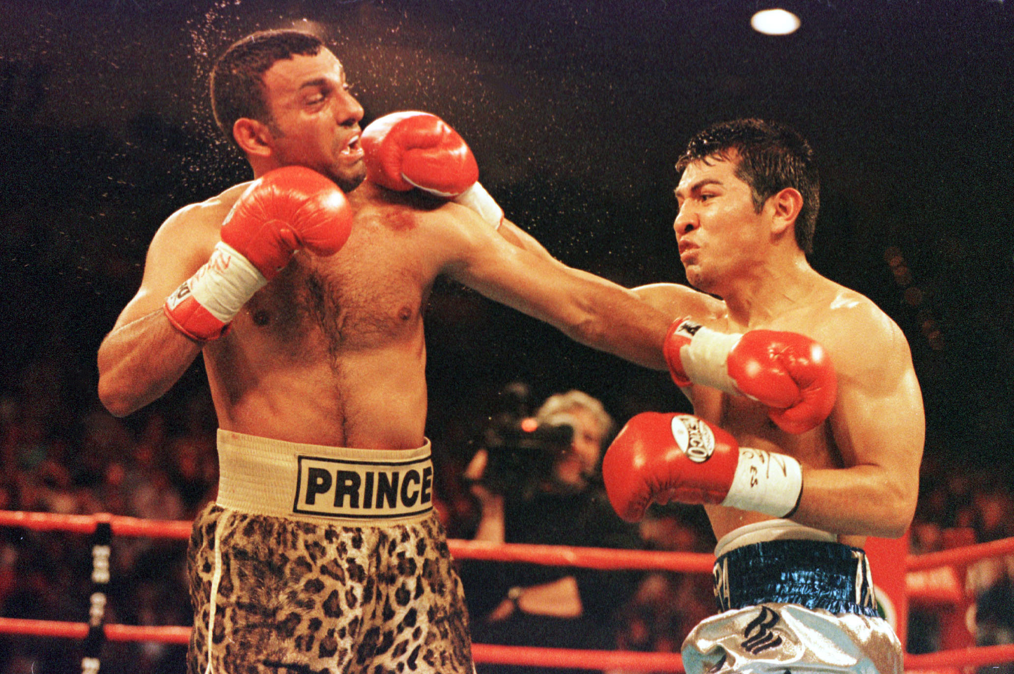 7 Apr 2001:  Marco Antonio Barrera of Mexico lands a punch against Prince Naseem Hamed of Great Britain during their bout at the MGM Grand Garden Arena in Las Vegas, Nevada. Mandatory Credit: Al Bello/ALLSPORT