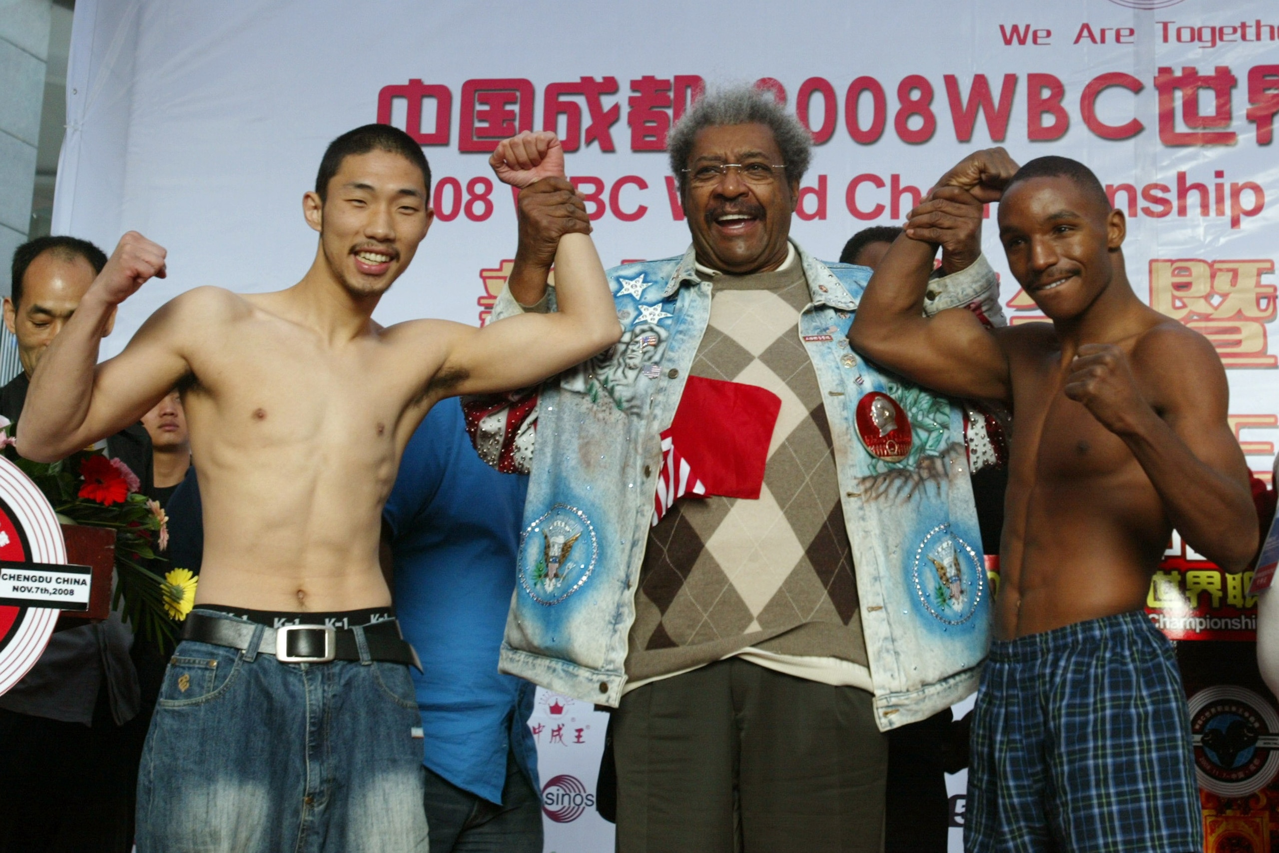 CHENGDU, CHINA - NOVEMBER 6: (CHINA OUT) (L to R) Sun-Haeng Lee of South Korea, US boxing promoter Don King and Devon Alexander of the USA attend the weigh-in ceremony prior to their 2008 WBC World Championship Lightweight bout on November 6, 2008 in C CHENGDU, CHINA - NOVEMBER 6: (CHINA OUT) (L to R) Sun-Haeng Lee of South Korea, US boxing promoter Don King and Devon Alexander of the USA attend the weigh-in ceremony prior to their 2008 WBC World Championship Lightweight bout on November 6, 2008 in C