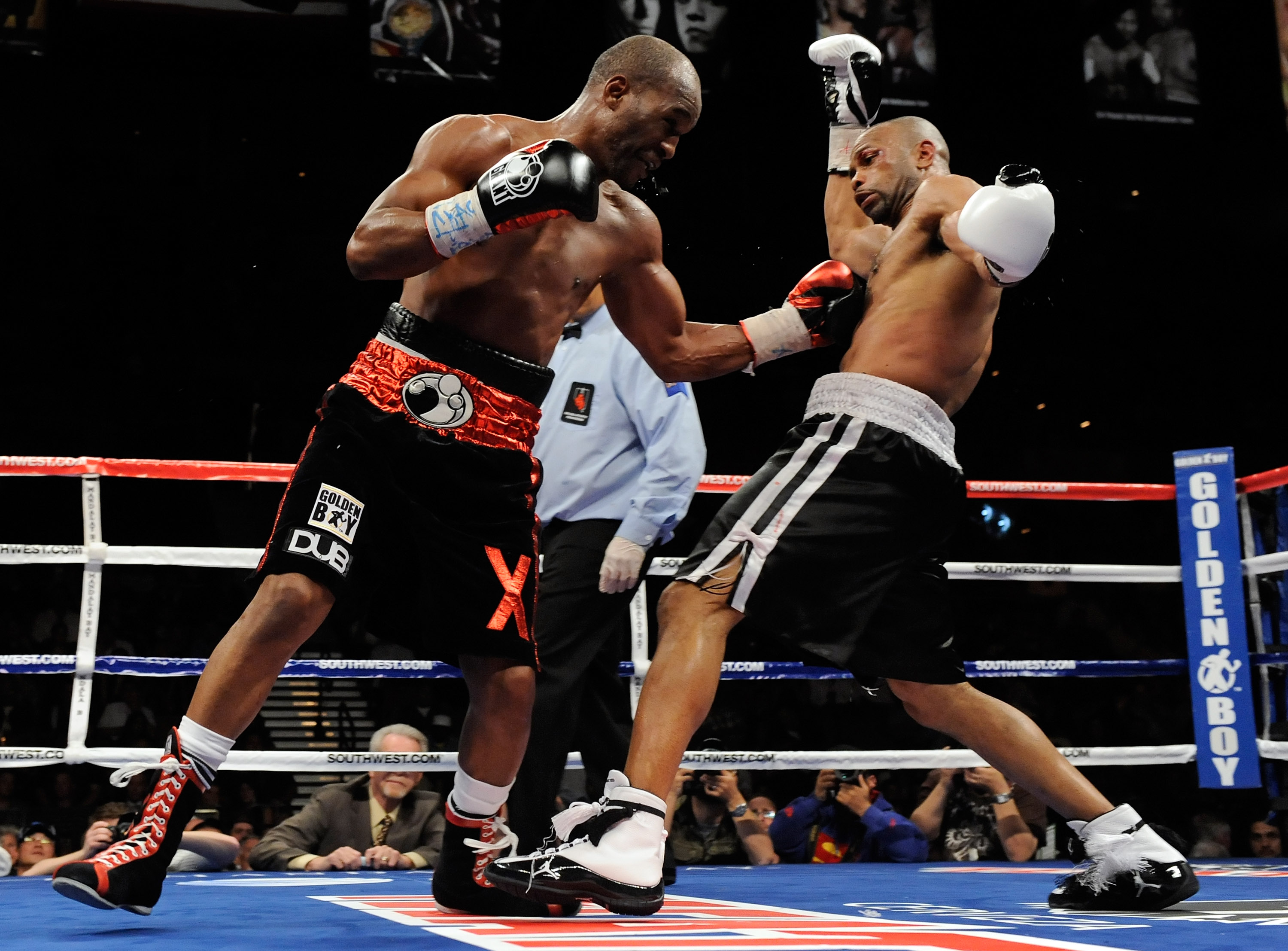 LAS VEGAS - APRIL 03:  Bernard Hopkins (L) hits Roy Jones Jr. during the 11th round of their light heavyweight bout at the Mandalay Bay Events Center April 3, 2010 in Las Vegas, Nevada. Hopkins won by unanimous decision.  (Photo by Ethan Miller/Getty Imag