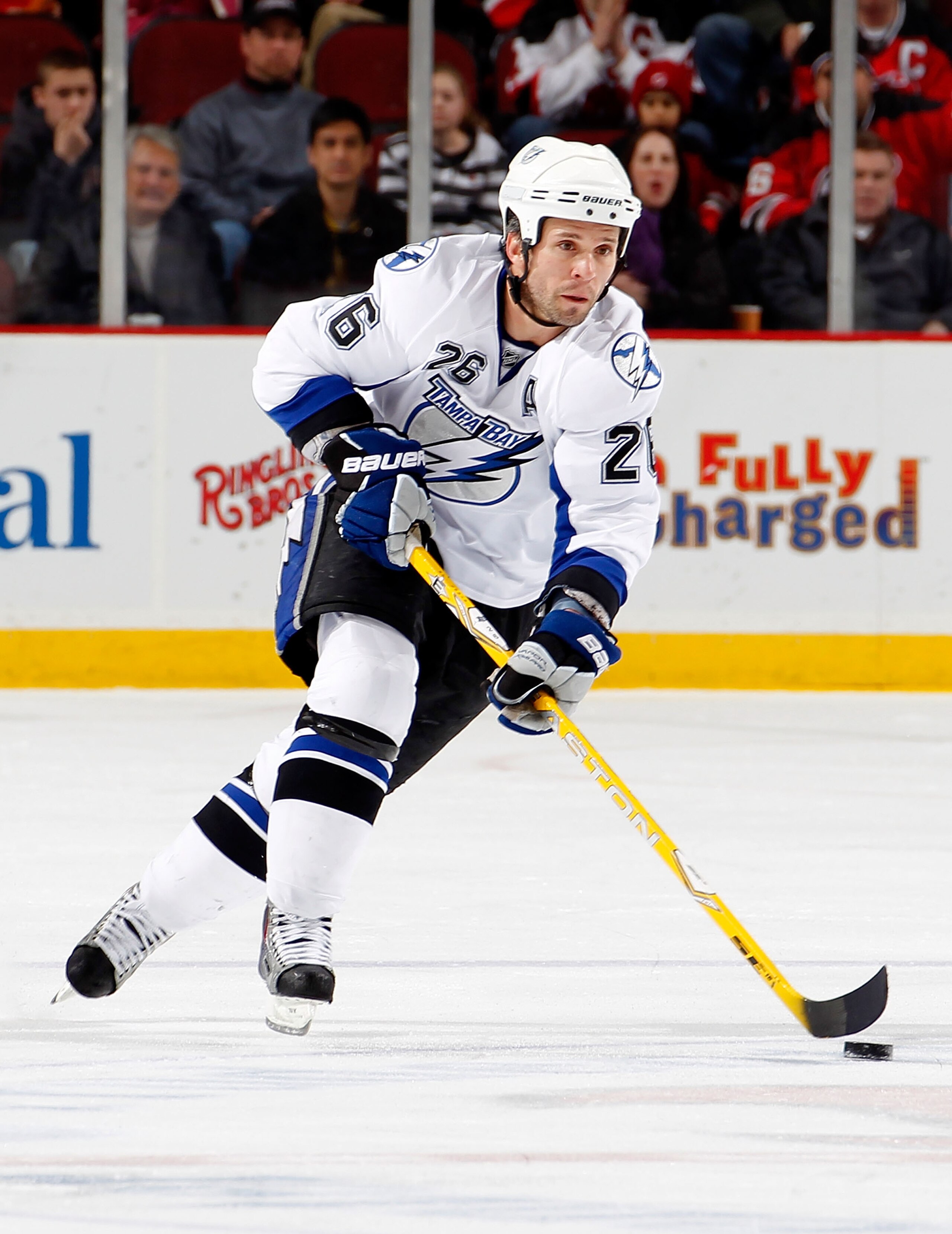 NEWARK, NJ - JANUARY 09:  Martin St. Louis #26 of the Tampa Bay Lightning skates during an NHL hockey game against the New Jersey Devils at the Prudential Center on January 9, 2011 in Newark, New Jersey.  (Photo by Paul Bereswill/Getty Images)