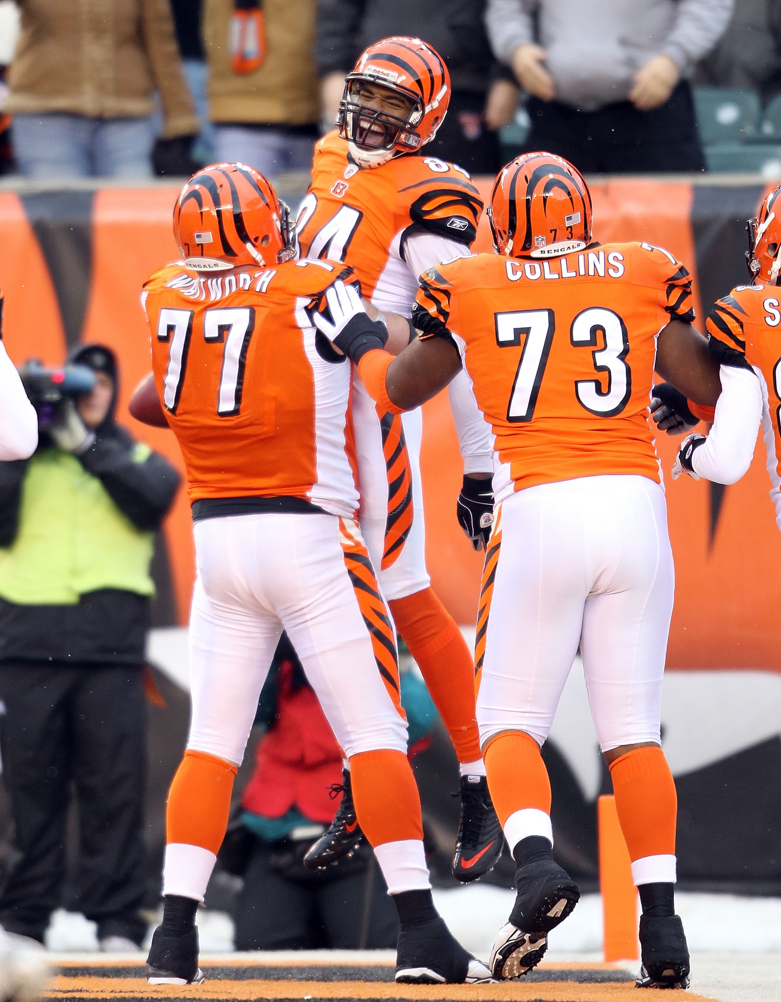 CINCINNATI - DECEMBER 26: Jermaine Gresham #84 of the Cincinnati Bengals celebrates with Andrew Whitworth #77 and Anthony Collins #73 after scoring a touchdown during the NFL game against the San Diego Chargers at Paul Brown Stadium on December 26, 2010 i