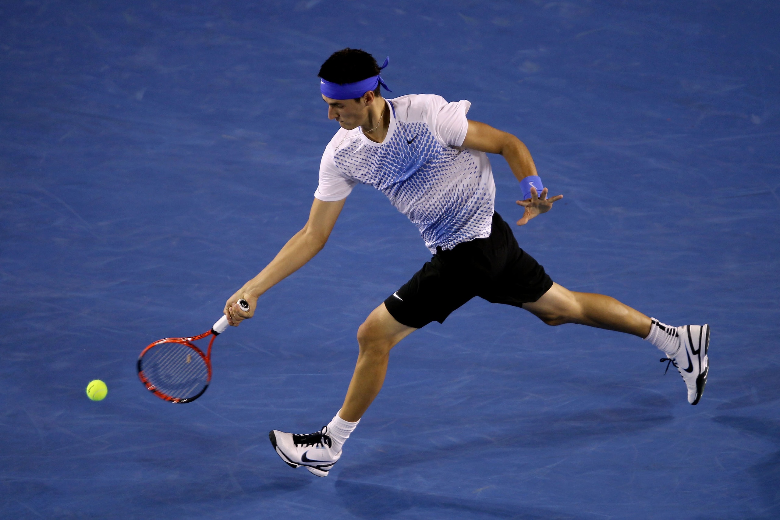 MELBOURNE, AUSTRALIA - JANUARY 22:  Bernard Tomic of Australia plays a forehand in his third round match against Rafael Nadal of Spain during day six of the 2011 Australian Open at Melbourne Park on January 22, 2011 in Melbourne, Australia.  (Photo by Cli