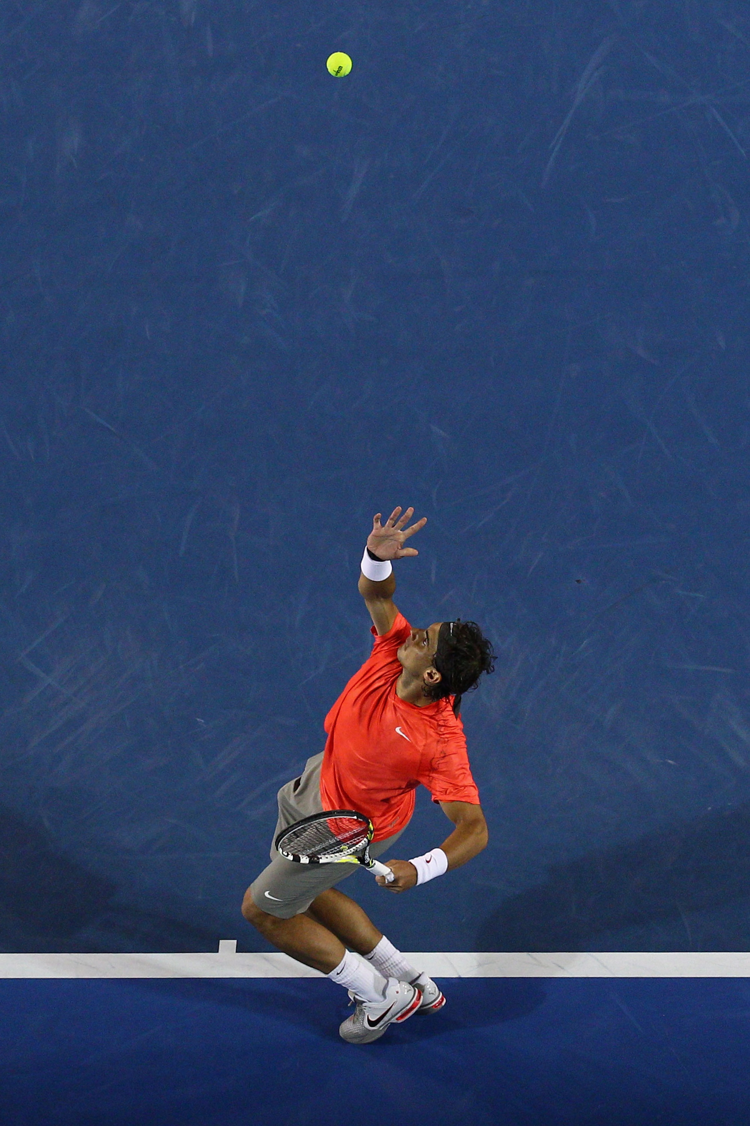 MELBOURNE, AUSTRALIA - JANUARY 24:  Rafael Nadal of Spain serves in his fourth round match against Marin Cilic of Croatia during day eight of the 2011 Australian Open at Melbourne Park on January 24, 2011 in Melbourne, Australia.  (Photo by Ryan Pierse/Ge