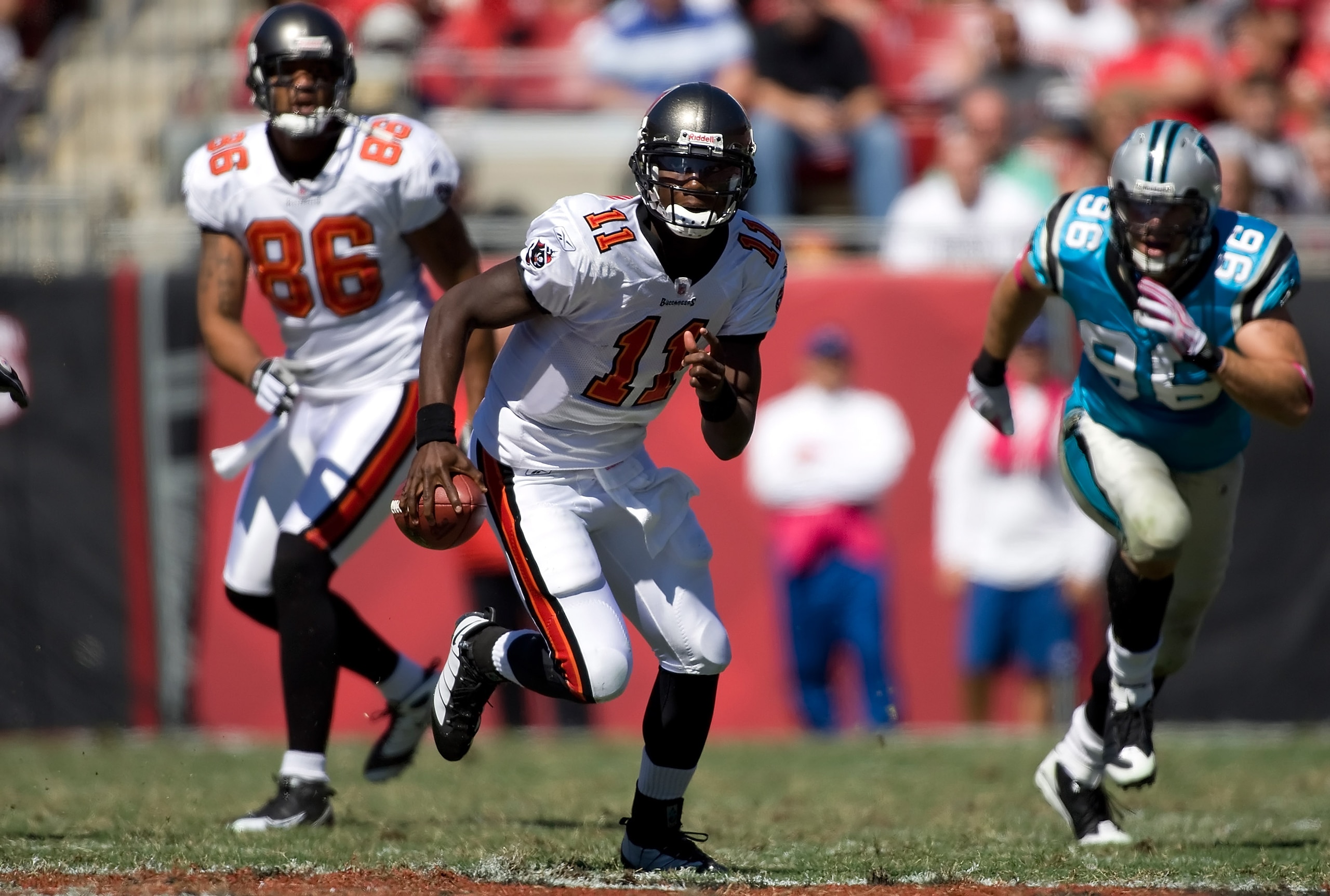 TAMPA, FL - OCTOBER 18:  Quarterback Josh Johnson #11 of the Tampa Bay Buccaneers scrambles against the Carolina Panthers during the game at Raymond James Stadium on October 18, 2009 in Tampa, Florida.  (Photo by J. Meric/Getty Images)