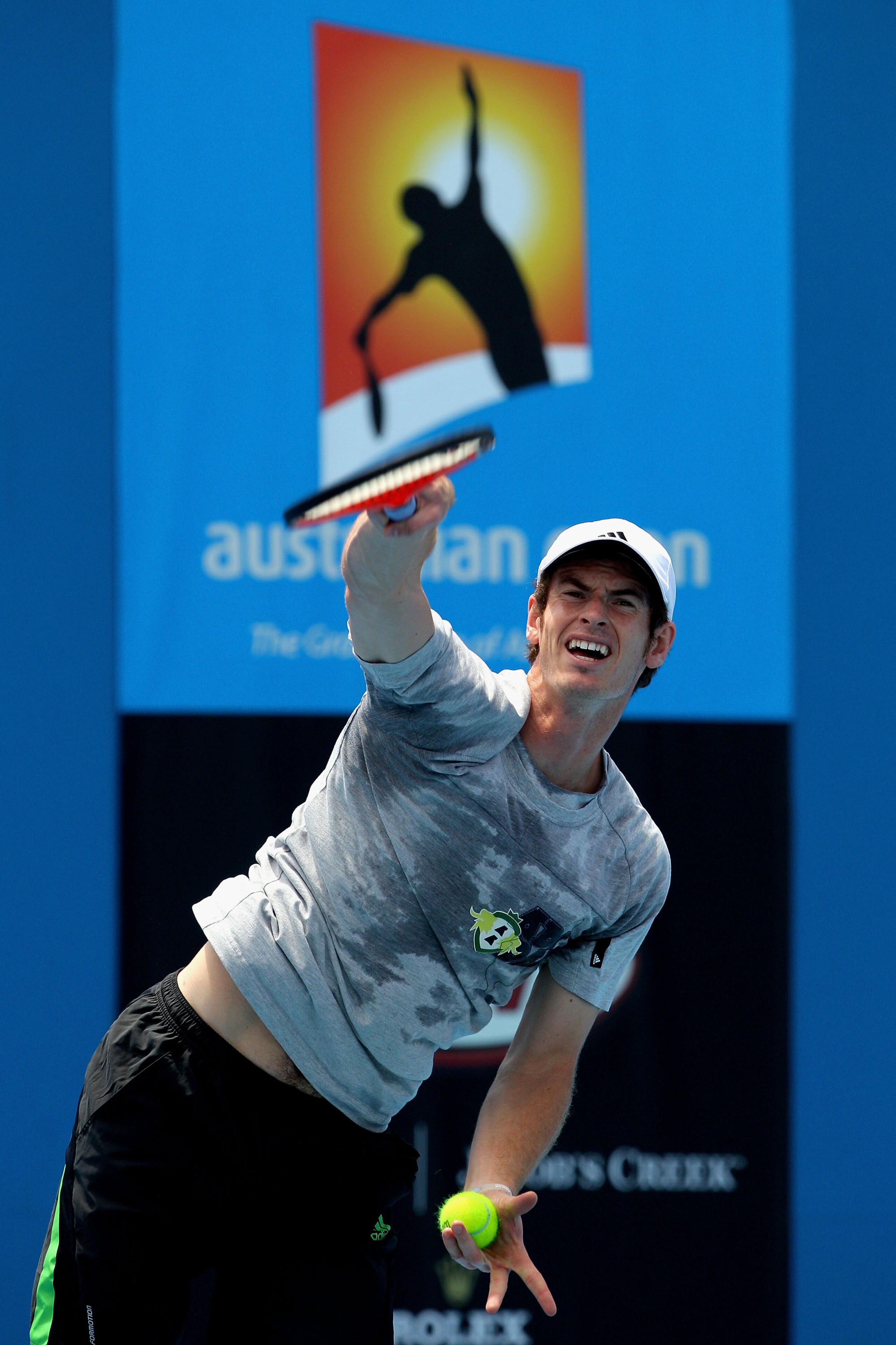 MELBOURNE, AUSTRALIA - JANUARY 25:  Andy Murray of Great Britain serves on the practice courts during day nine of the 2011 Australian Open at Melbourne Park on January 25, 2011 in Melbourne, Australia.  (Photo by Lucas Dawson/Getty Images)