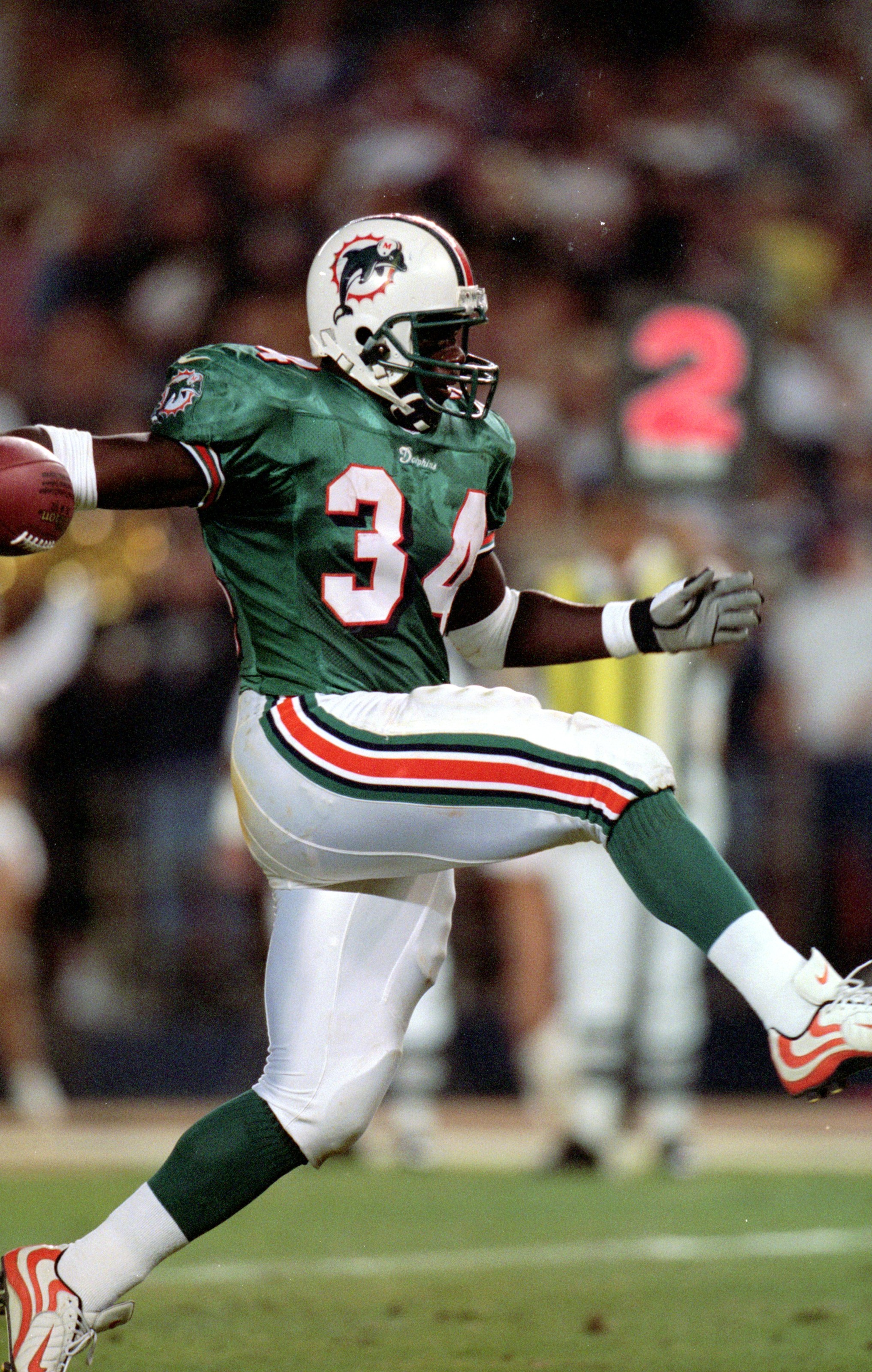 21 Aug 1999:  Cecil Collins #34 of the Miami Dolphins moves with the ball during the game against the San Diego Chargers at Qualcomm Stadium in San Diego, California. The Dolphins defeated the Chargers 13-10. Mandatory Credit: Tom Hauck  /Allsport