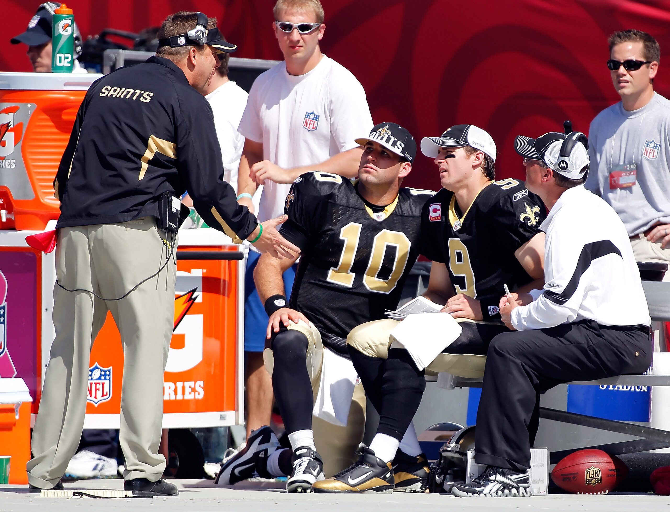 TAMPA, FL - OCTOBER 17:  Head coach Sean Payton of the New Orleans Saints talks with quarterbacks Chase Daniel #10 and Drew Brees #9 on the bench against the Tampa Bay Buccaneers during the game at Raymond James Stadium on October 17, 2010 in Tampa, Flori