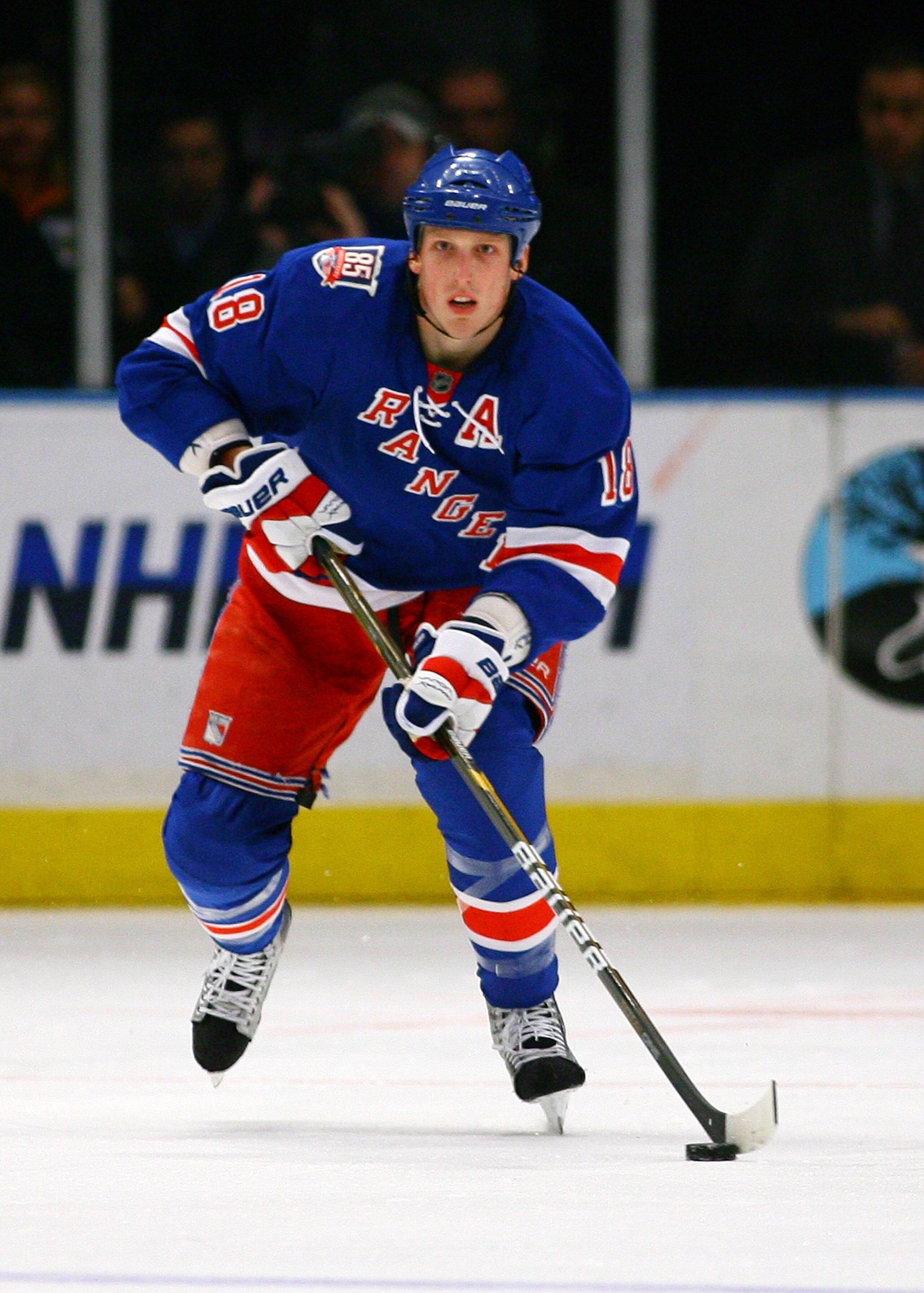 NEW YORK , NY - JANUARY 13: Marc Staal #18 of the New York Rangers plays the puck against the Vancouver Canucks during the game at Madison Square Garden on January 13, 2011 in New York City. (Photo by Andy Marlin/Getty Images)