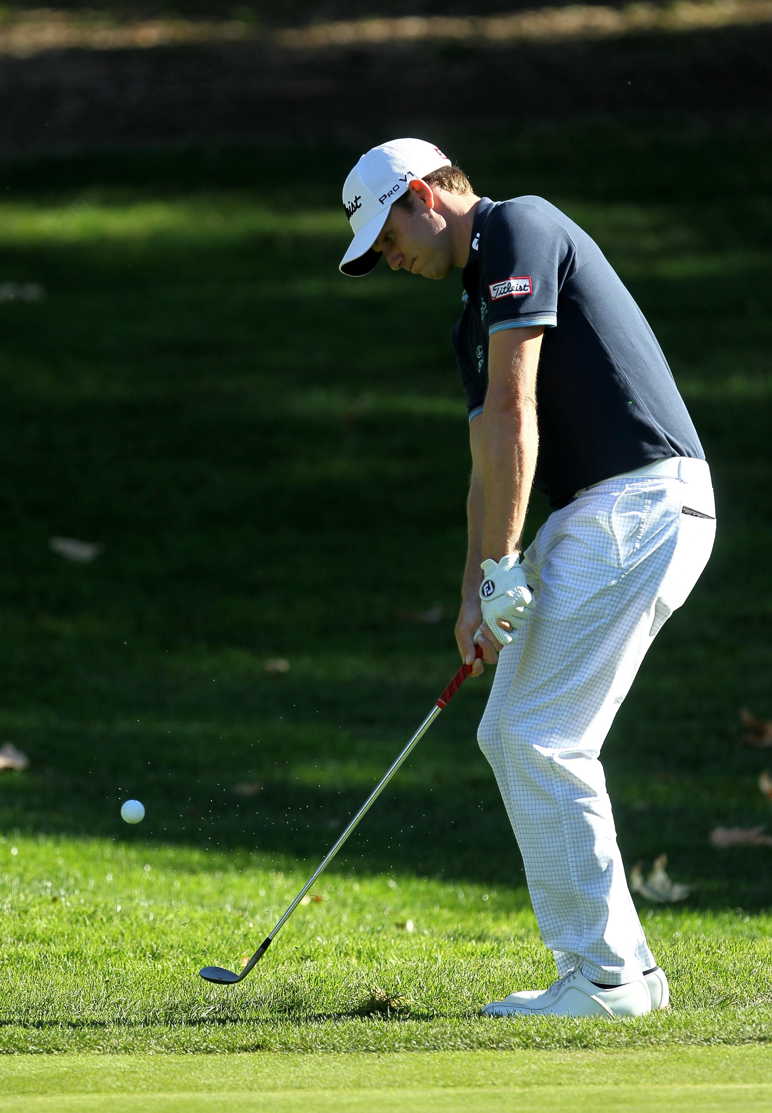 THOUSAND OAKS, CA - DECEMBER 02: Nick Watney chips onto the fifth green during the Chevron World Challenge at Sherwood Country Club on December 2, 2010 in Thousand Oaks, California.  (Photo by Stephen Dunn/Getty Images)
