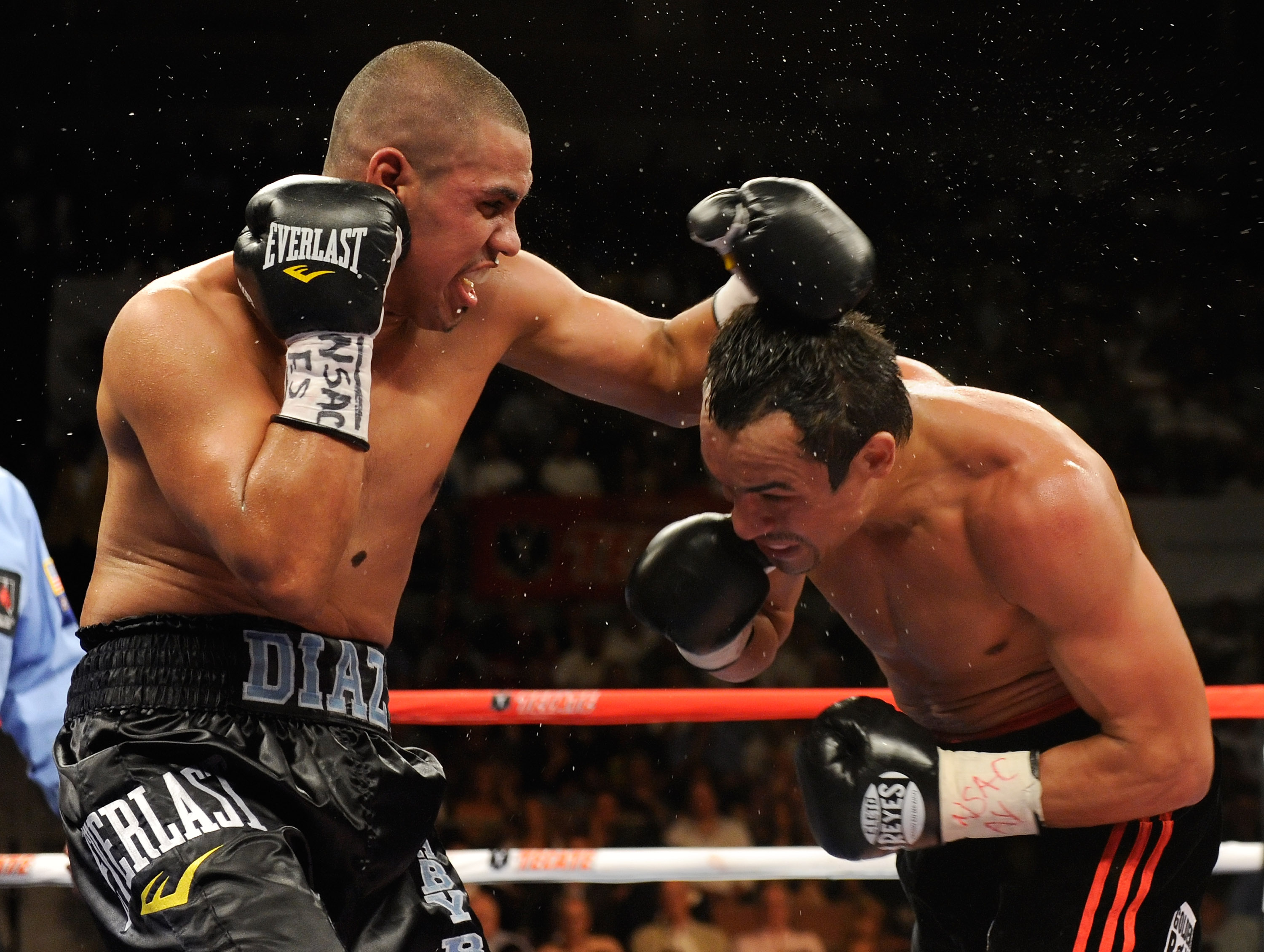 LAS VEGAS - JULY 31:  Juan Diaz (L) hits WBA/WBO lightweight champion Juan Manuel Marquez in the fifth round of their bout at the Mandalay Bay Events Center July 31, 2010 in Las Vegas, Nevada. Marquez retained his WBA and WBO lightweight championship belt