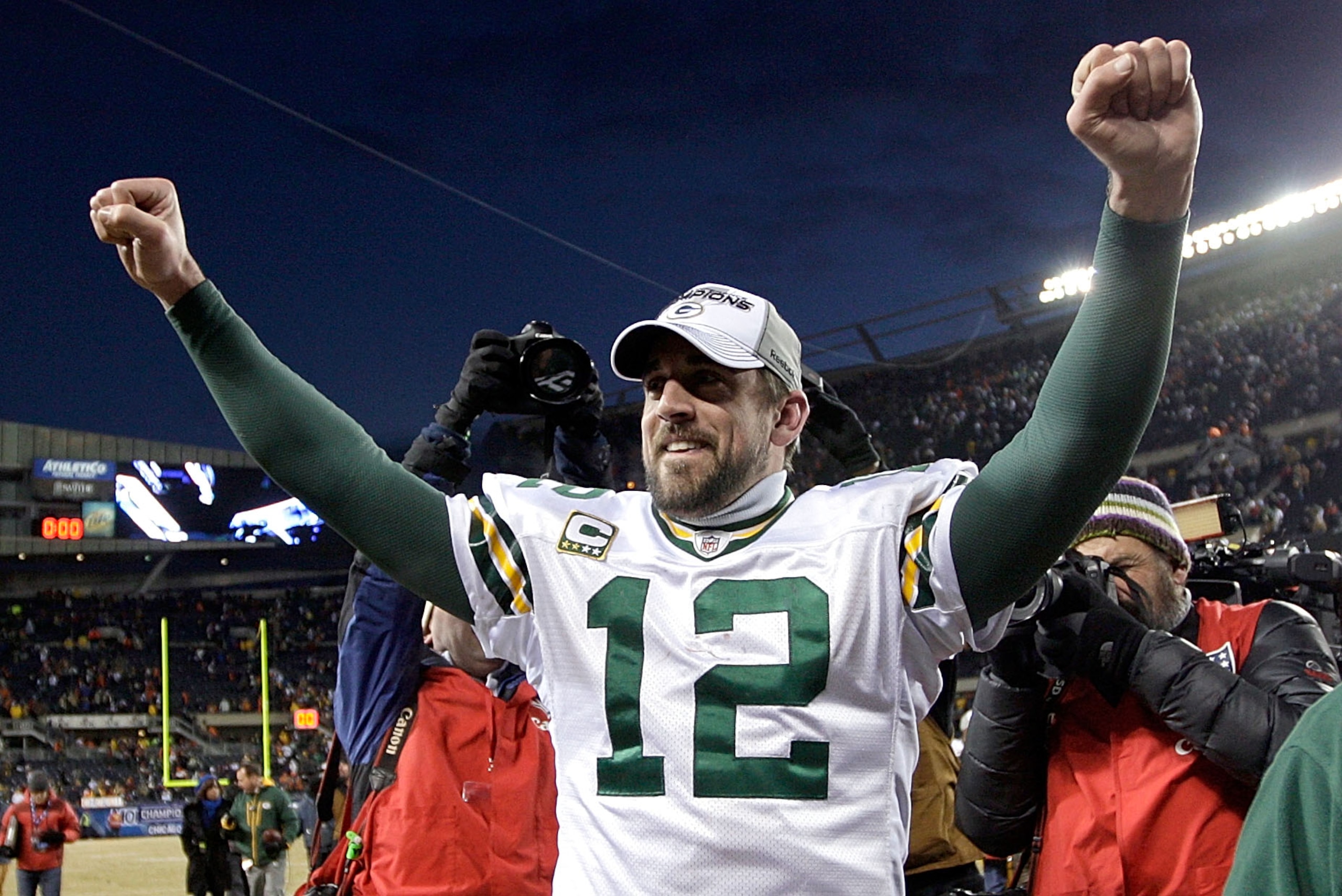 CHICAGO, IL - JANUARY 23:  Quarterback Aaron Rodgers #12 of the Green Bay Packers celebrates the Packers 21-14 victory against the Chicago Bears in the NFC Championship Game at Soldier Field on January 23, 2011 in Chicago, Illinois.  (Photo by Jamie Squir