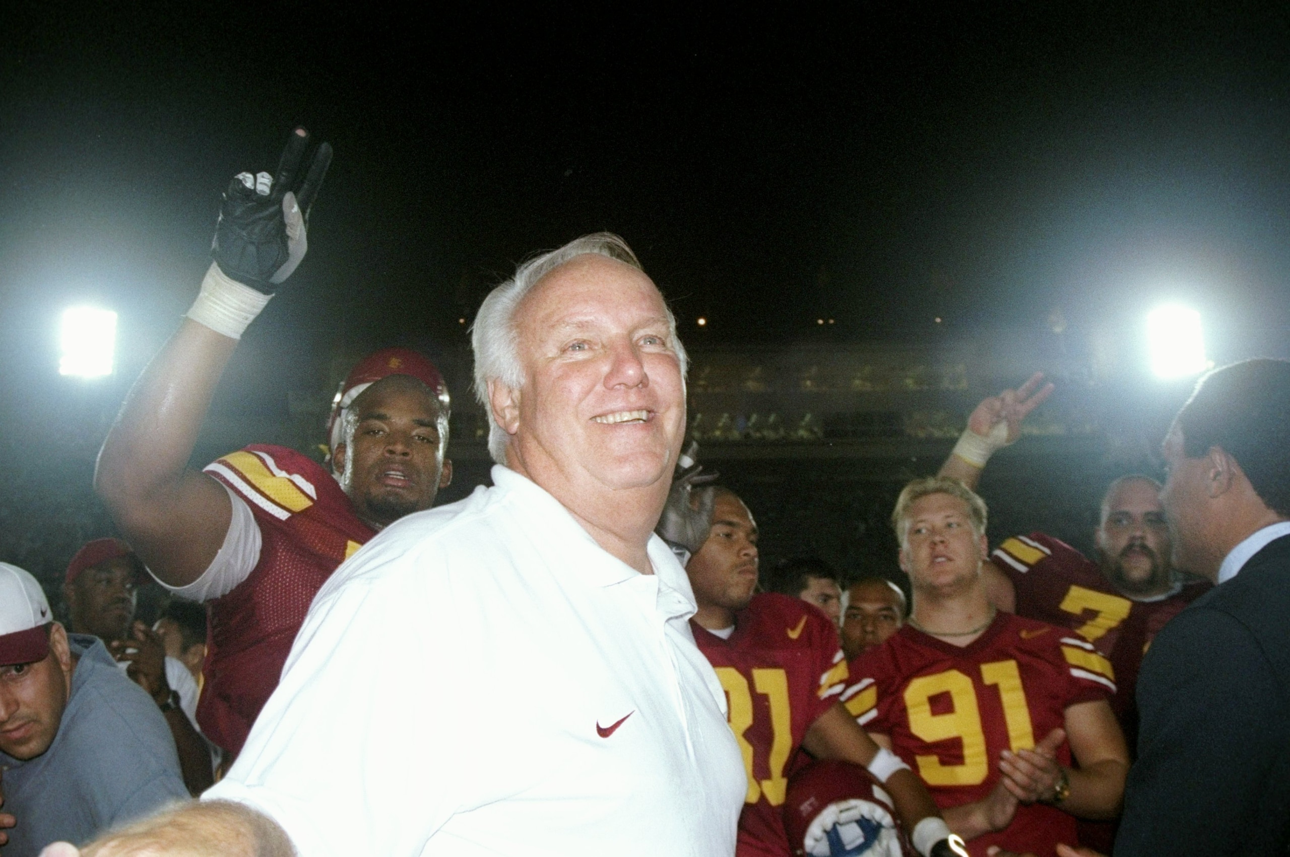 4 Oct 1997:  Head coach John Robinson of the USC Trojans celebrates his 100th win after a game against the UNLV Running Rebels at the Los Angeles Coliseum in Los Angeles, California.  USC won the game 35-21. Mandatory Credit: Jon Ferrey  /Allsport