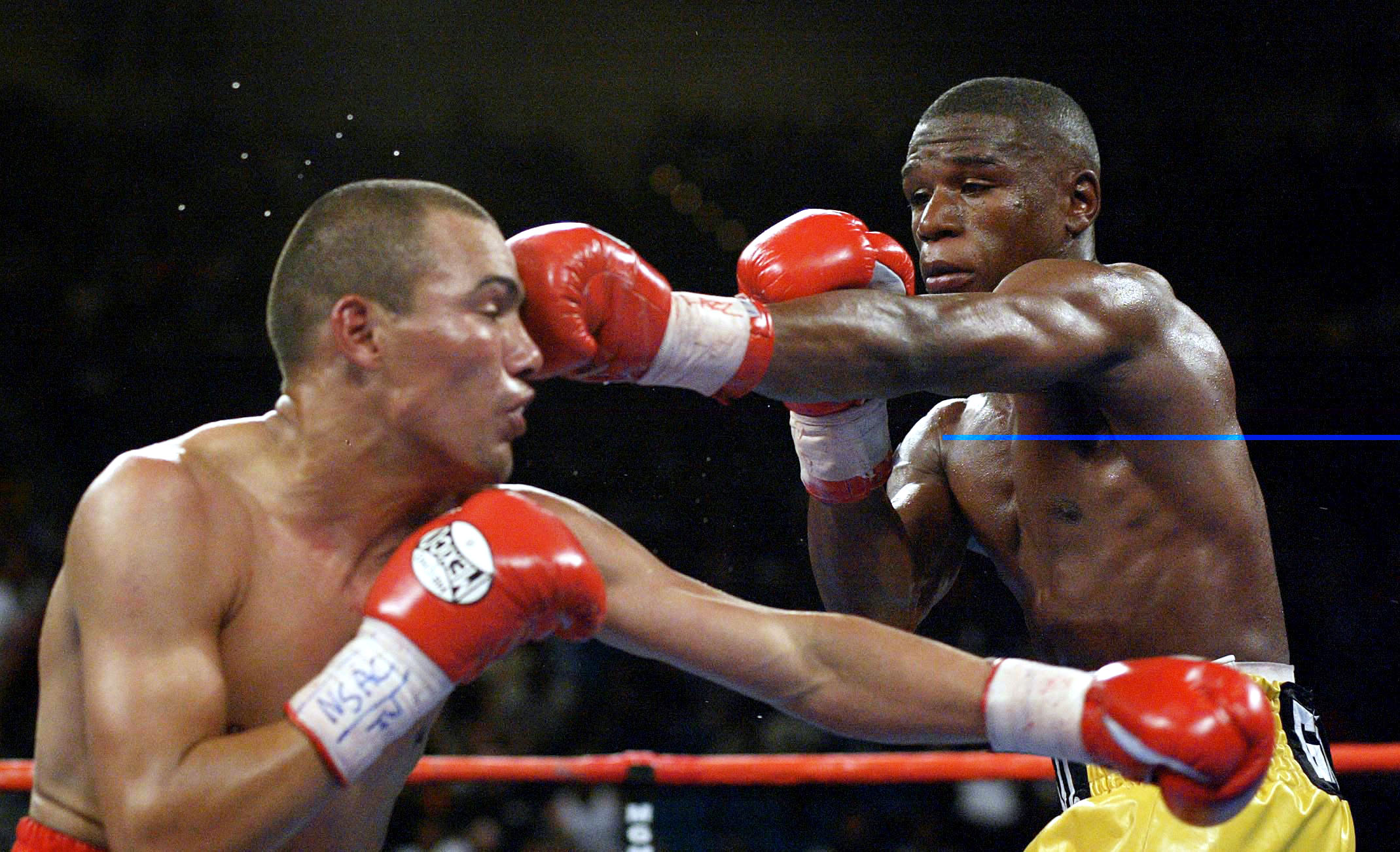 20 Apr 2002:   Floyd Mayweather (right) hits Jose Luis Castillo during the WBC Lightweight Championship at the MGM Grand Garden Arena in Las Vegas, Nevada.    DIGITAL IMAGE    Mandatory Credit: Jed Jacobsohn\\Getty Images