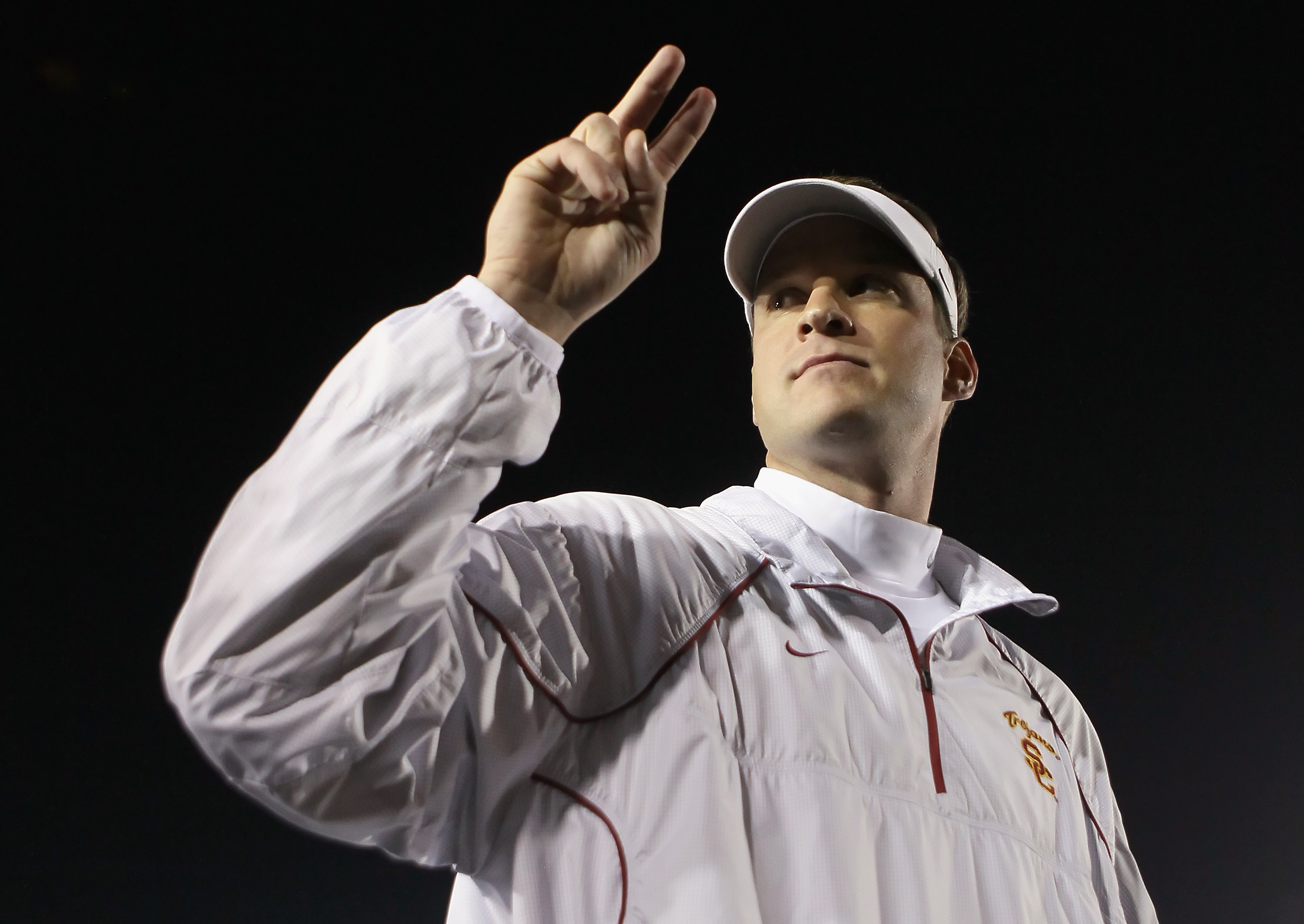 PASADENA, CA - DECEMBER 04:  USC Trojans head coach Lane Kiffin celebrates following his teams victory over the UCLA Bruins at the Rose Bowl on December 4, 2010 in Pasadena, California.  USC defeated UCLA 28-14.  (Photo by Jeff Gross/Getty Images)