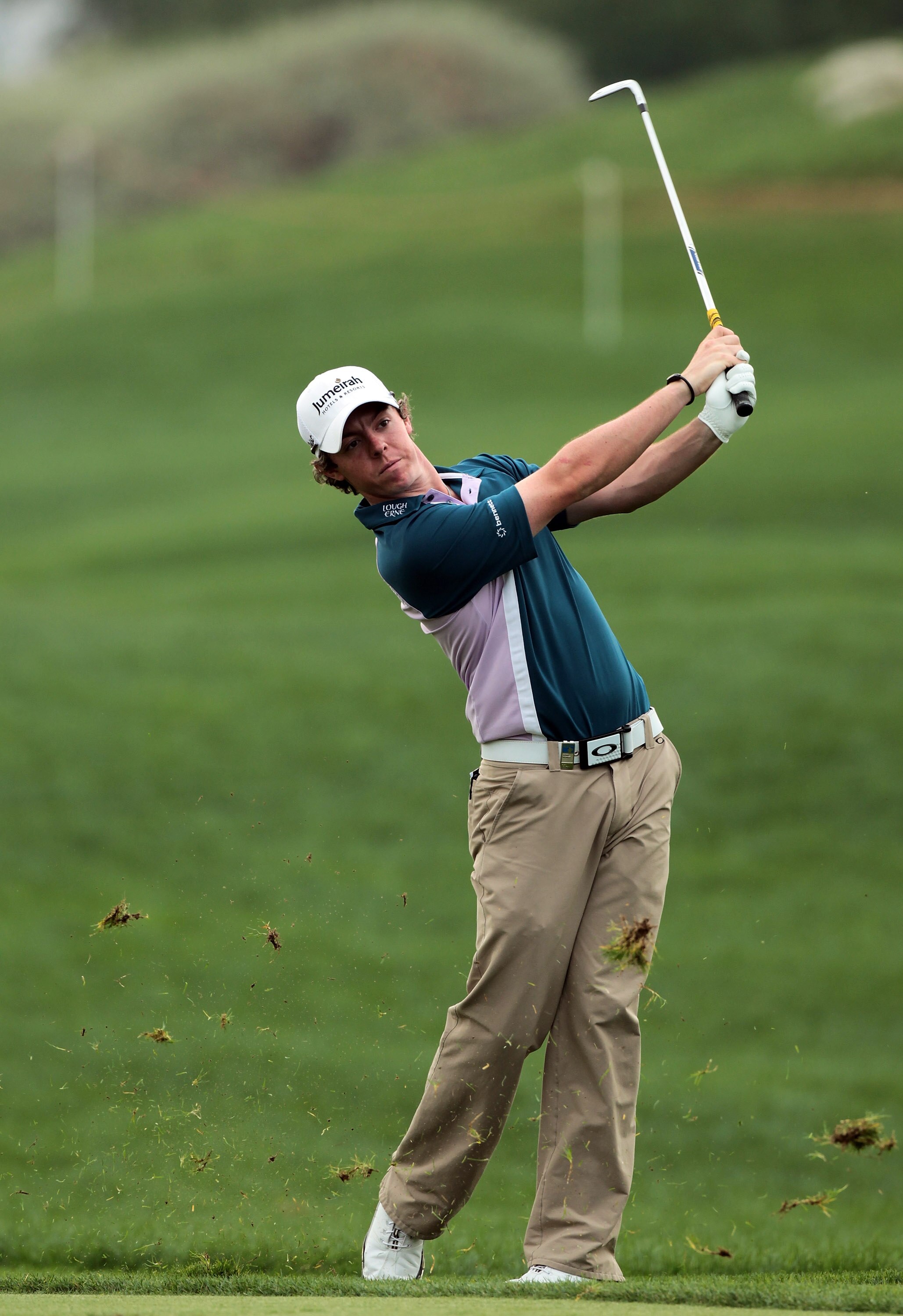 ABU DHABI, UNITED ARAB EMIRATES - JANUARY 22:  Rory McIlroy of Northern Ireland plays his second shot to the 13th hole during the final round of the 2011 Abu Dhabi HSBC Golf Championship held at the Abu Dhabi Golf Club on January 23, 2011 in Abu Dhabi, Un