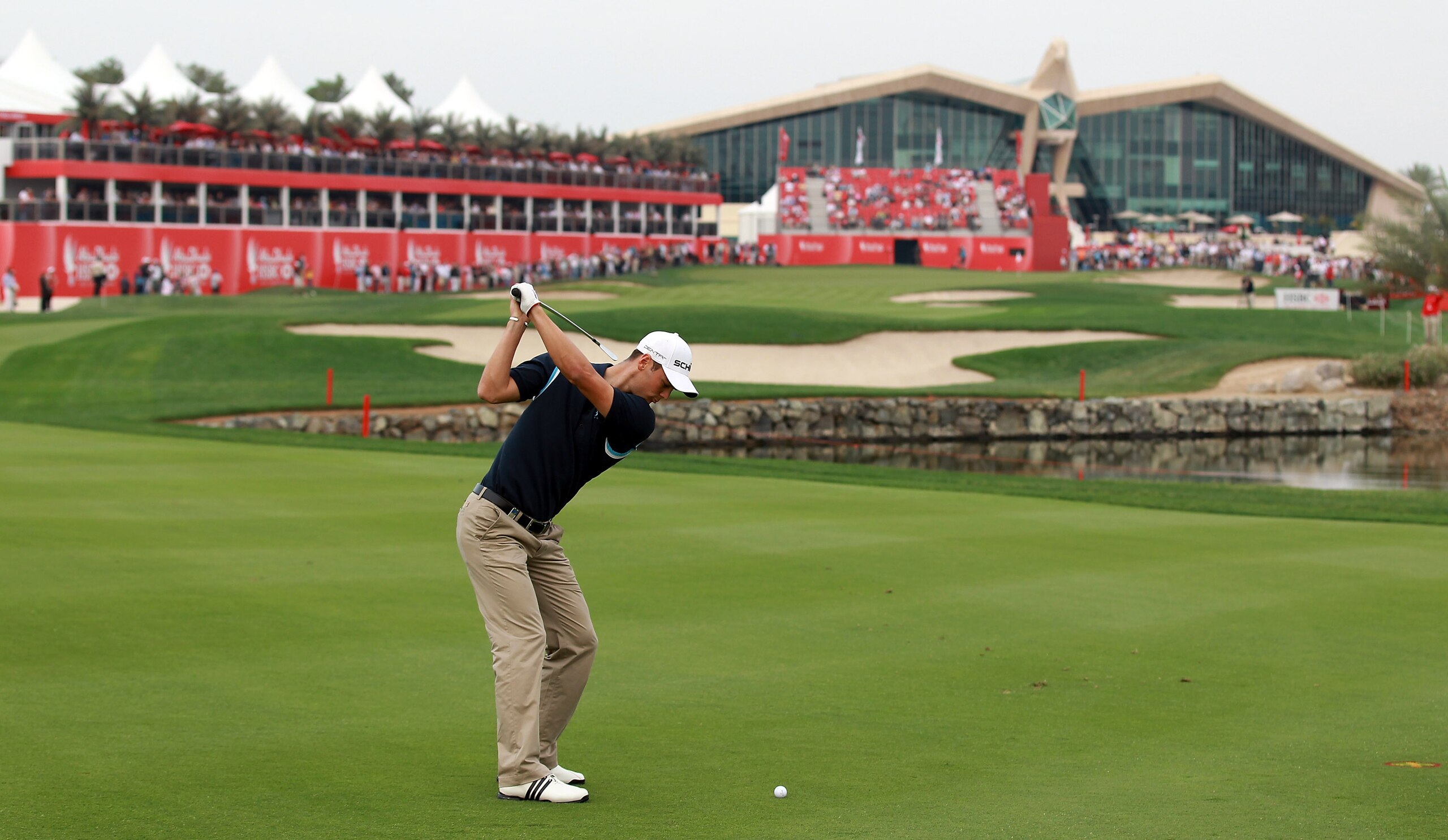 ABU DHABI, UNITED ARAB EMIRATES - JANUARY 22:  Martin Kaymer of Germany playing his second shot at the 18th hole during the third round of the 2011 Abu Dhabi HSBC Golf Championship held at the Abu Dhabi Golf Club on January 22, 2011 in Abu Dhabi, United A