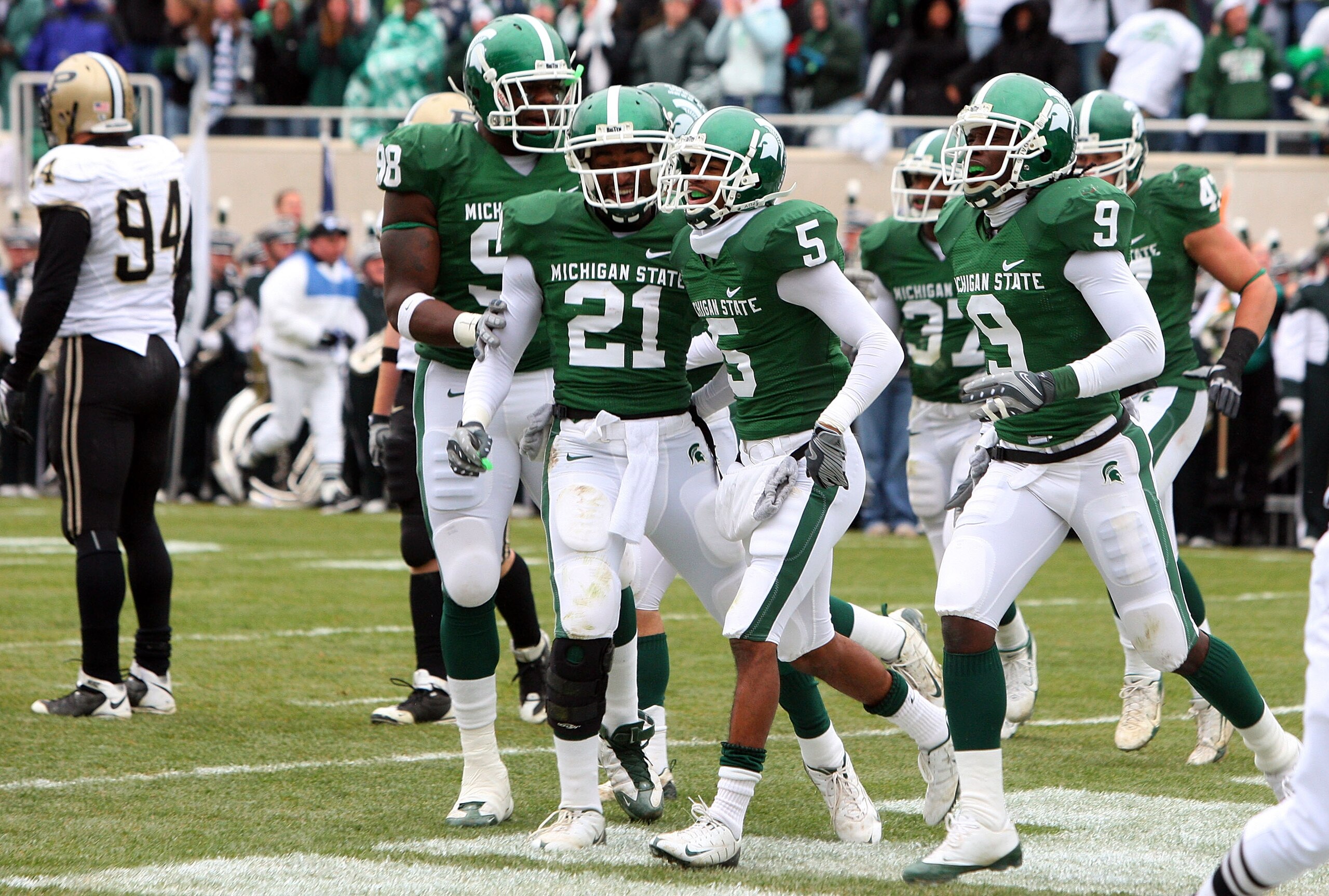 EAST LANSING, MI - NOVEMBER 08:  Johnny Adams #5 of the Michigan State Spartans celebrates his touchdown after an interception against the Purdue Boilermakers for a touchdown at Spartan Stadium on November 8, 2008 in East Lansing, Michigan.  (Photo by Jim