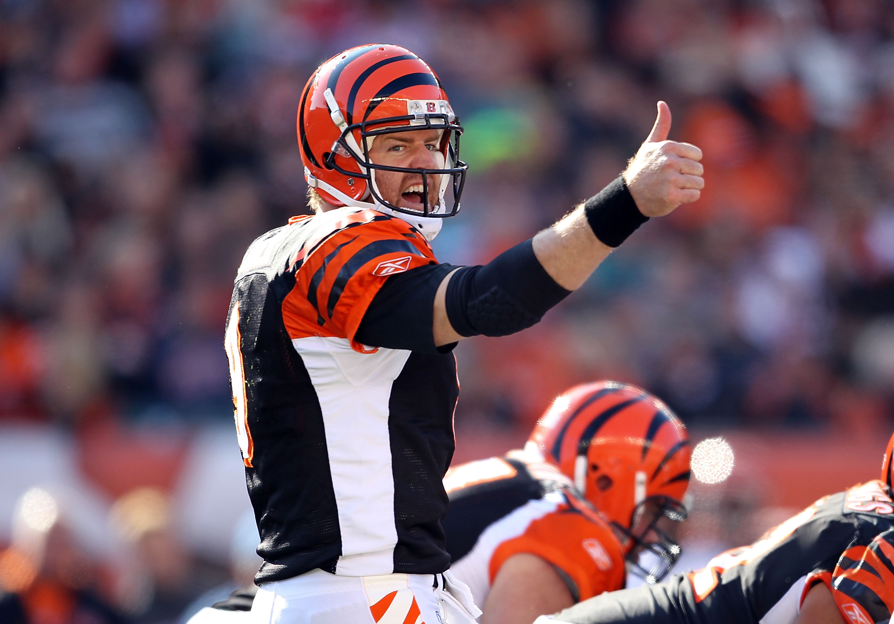 CINCINNATI - OCTOBER 31:  Carson Palmer #9 of  the Cincinnati Bengals gives instructions to his team during the NFL game against the Miami Dolphins at Paul Brown Stadium on October 31, 2010 in Cincinnati, Ohio.  (Photo by Andy Lyons/Getty Images)