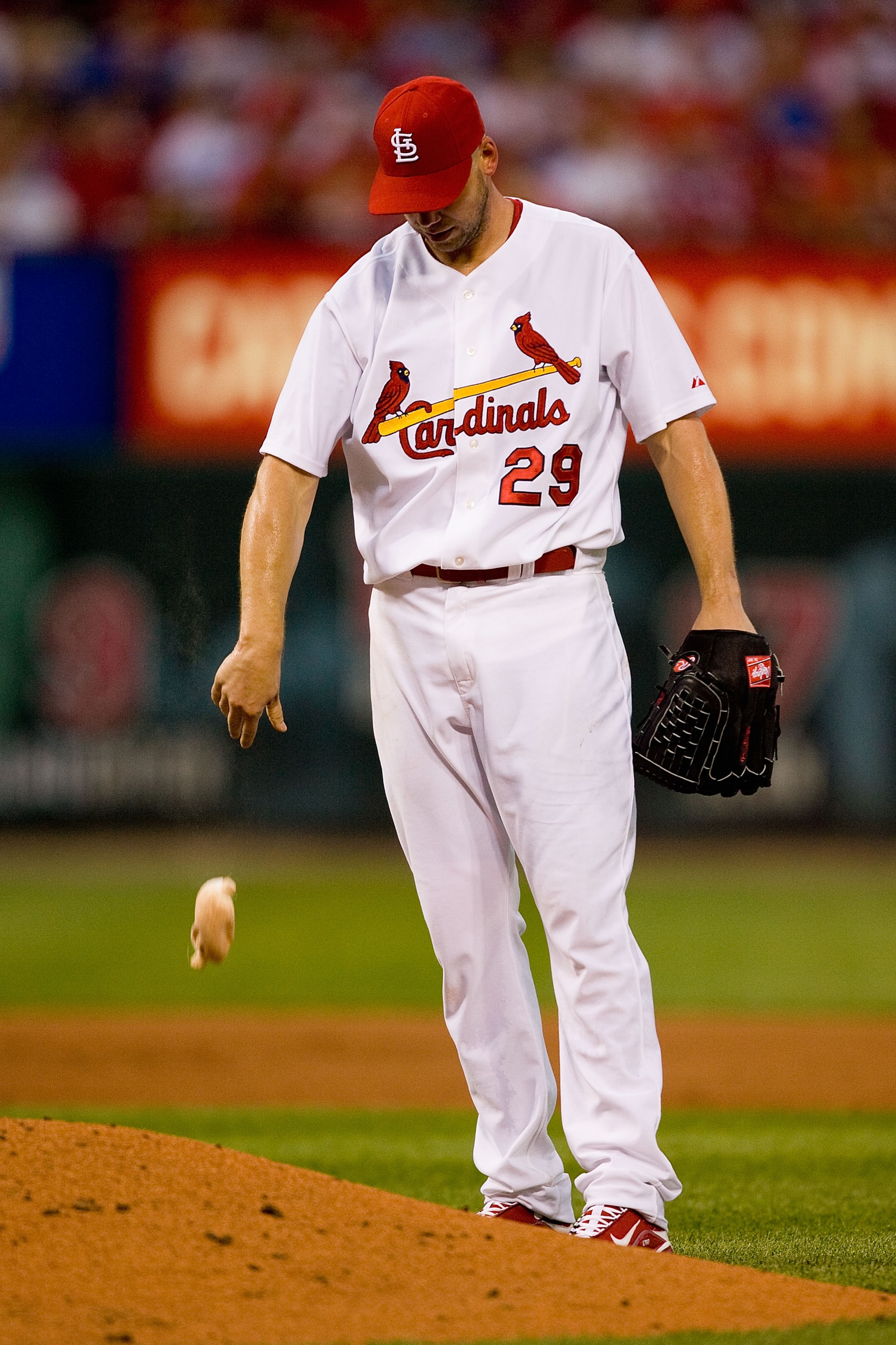 ST. LOUIS - JULY 15:  Starting pitcher Chris Carpenter #29 of the St. Louis Cardinals reacts to giving up a home run against the Los Angeles Dodgers at Busch Stadium on July 15, 2010 in St. Louis, Missouri.  (Photo by Dilip Vishwanat/Getty Images)