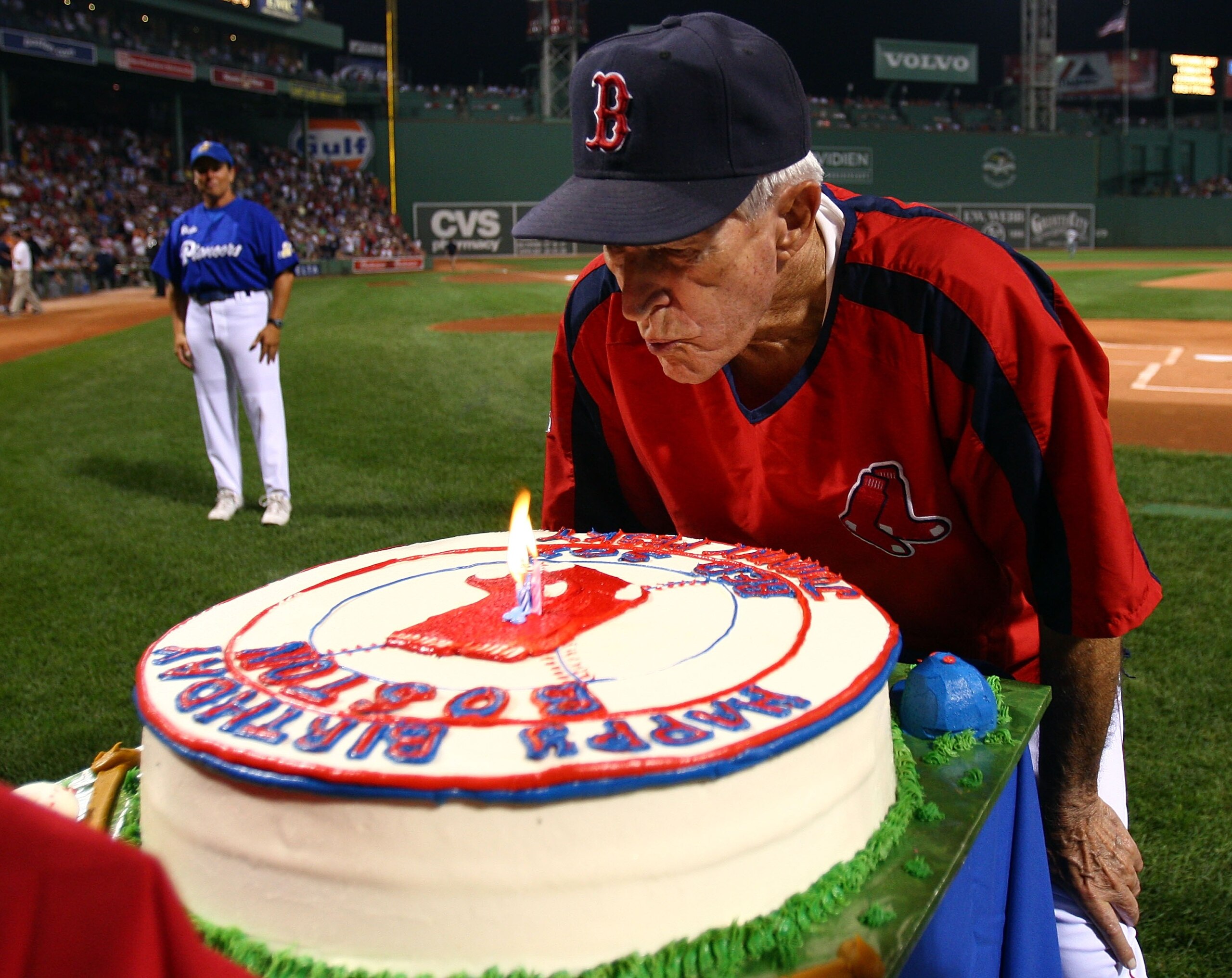 BOSTON - SEPTEMBER 27:  Red Sox legend Johnny Pesky blows out the candles on his birthday cake before the Boston Red Sox take on the Minnesota Twins on September 27, 2007 at Fenway Park in Boston, Massachusetts. The Red Sox honored Pesky's 88th birthday i