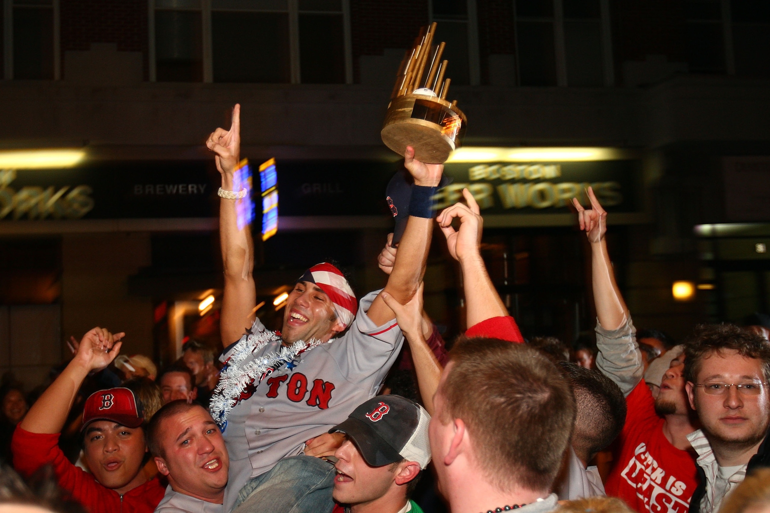 BOSTON - OCTOBER 29:  Fans celebrate on Brookline Avenue near Fenway Park after the Boston Red Sox defeated the Colorado Rockies 4-3 in Game Four of the World Series on October 29, 2007 in Boston, Massachusetts. The Red Sox swept the Rockies in four games