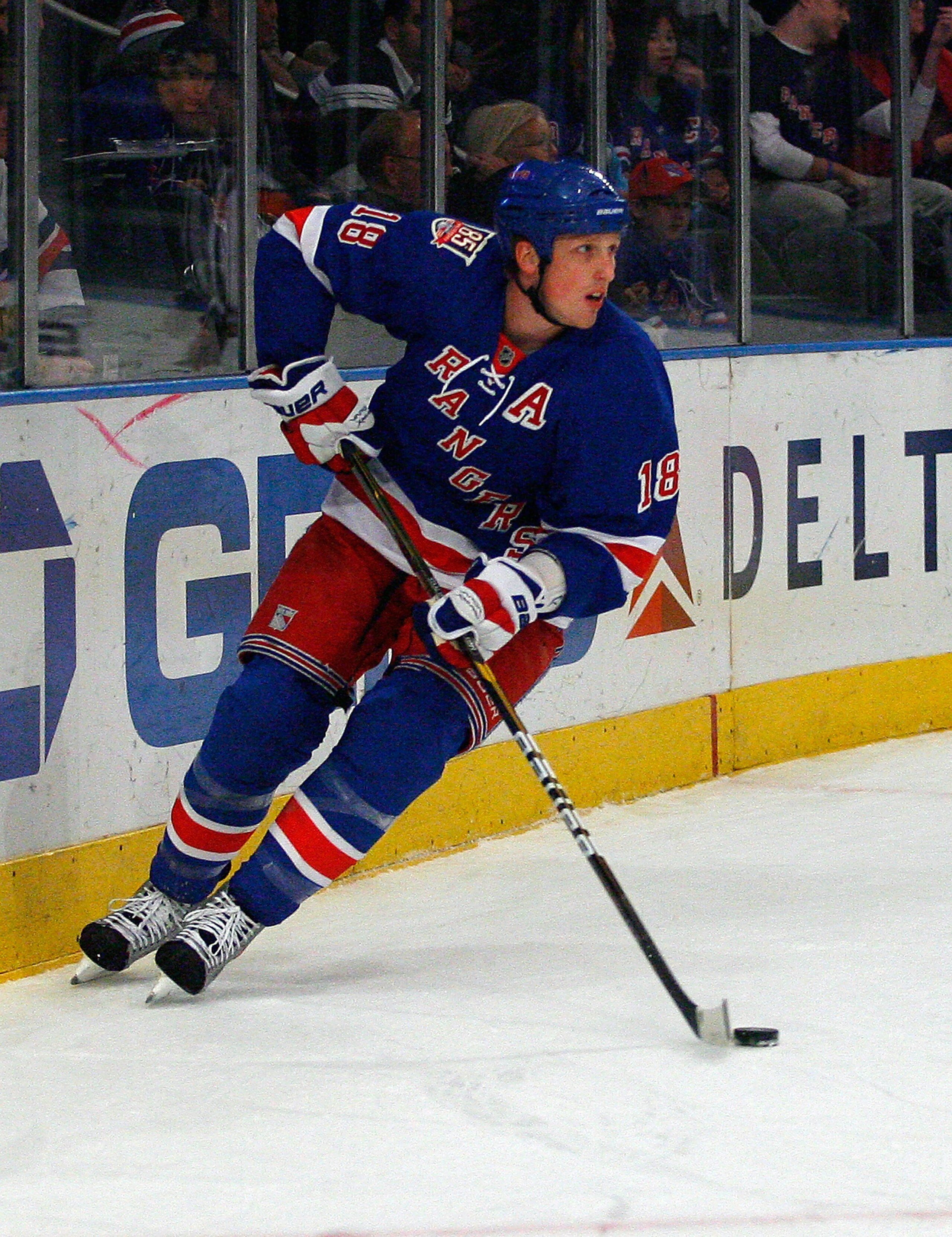 NEW YORK , NY - JANUARY 13: Marc Staal #18 of the New York Rangers plays the puck against the Vancouver Canucks during the game at Madison Square Garden on January 13, 2011 in New York City. (Photo by Andy Marlin/Getty Images)