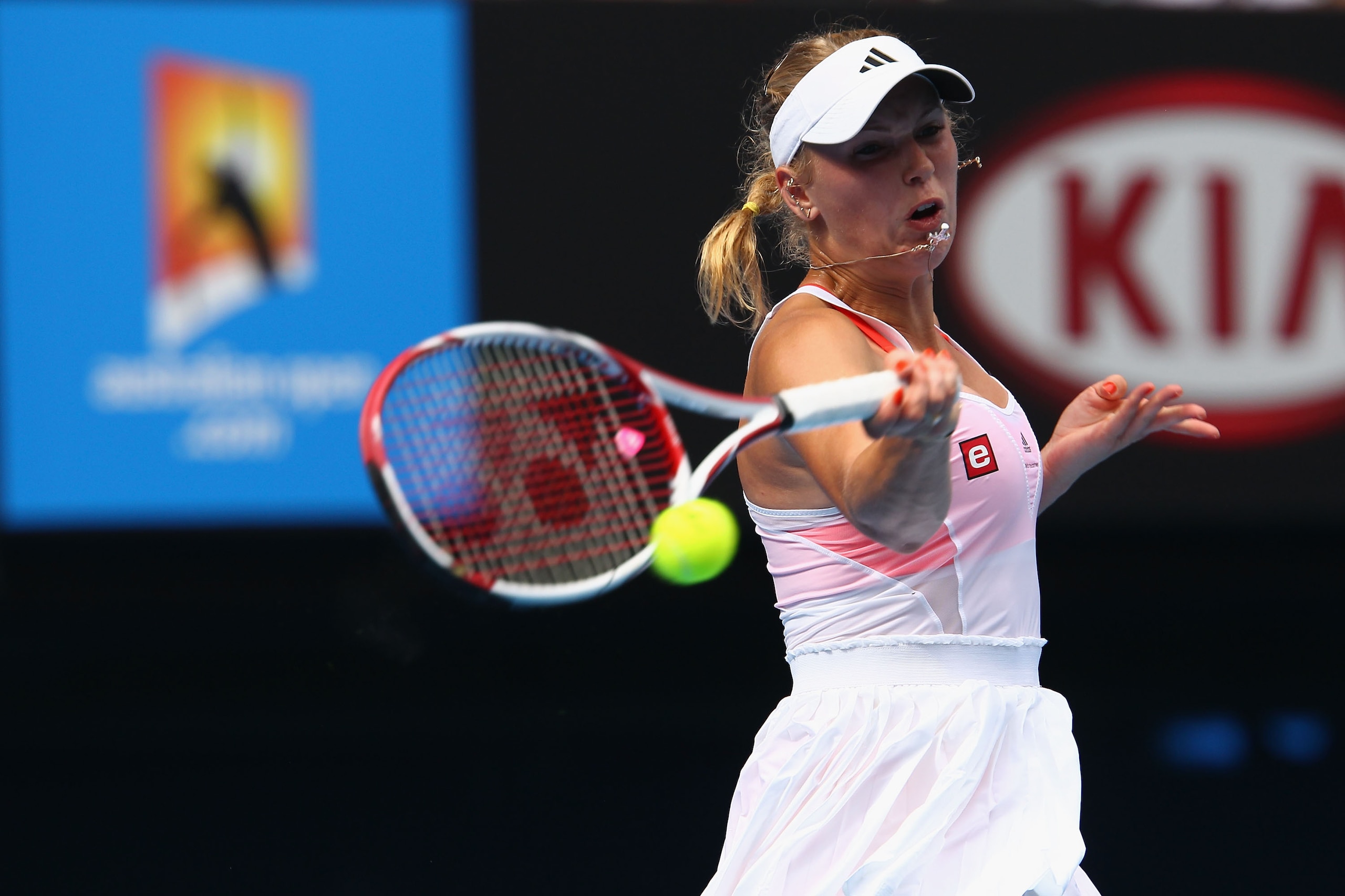 MELBOURNE, AUSTRALIA - JANUARY 25: Caroline Wozniacki of Denmark plays a forehand during her quarterfinal match against Francesca Schiavone of Italy during day nine of the 2011 Australian Open at Melbourne Park on January 25, 2011 in Melbourne, Australia MELBOURNE, AUSTRALIA - JANUARY 25: Caroline Wozniacki of Denmark plays a forehand during her quarterfinal match against Francesca Schiavone of Italy during day nine of the 2011 Australian Open at Melbourne Park on January 25, 2011 in Melbourne, Australia