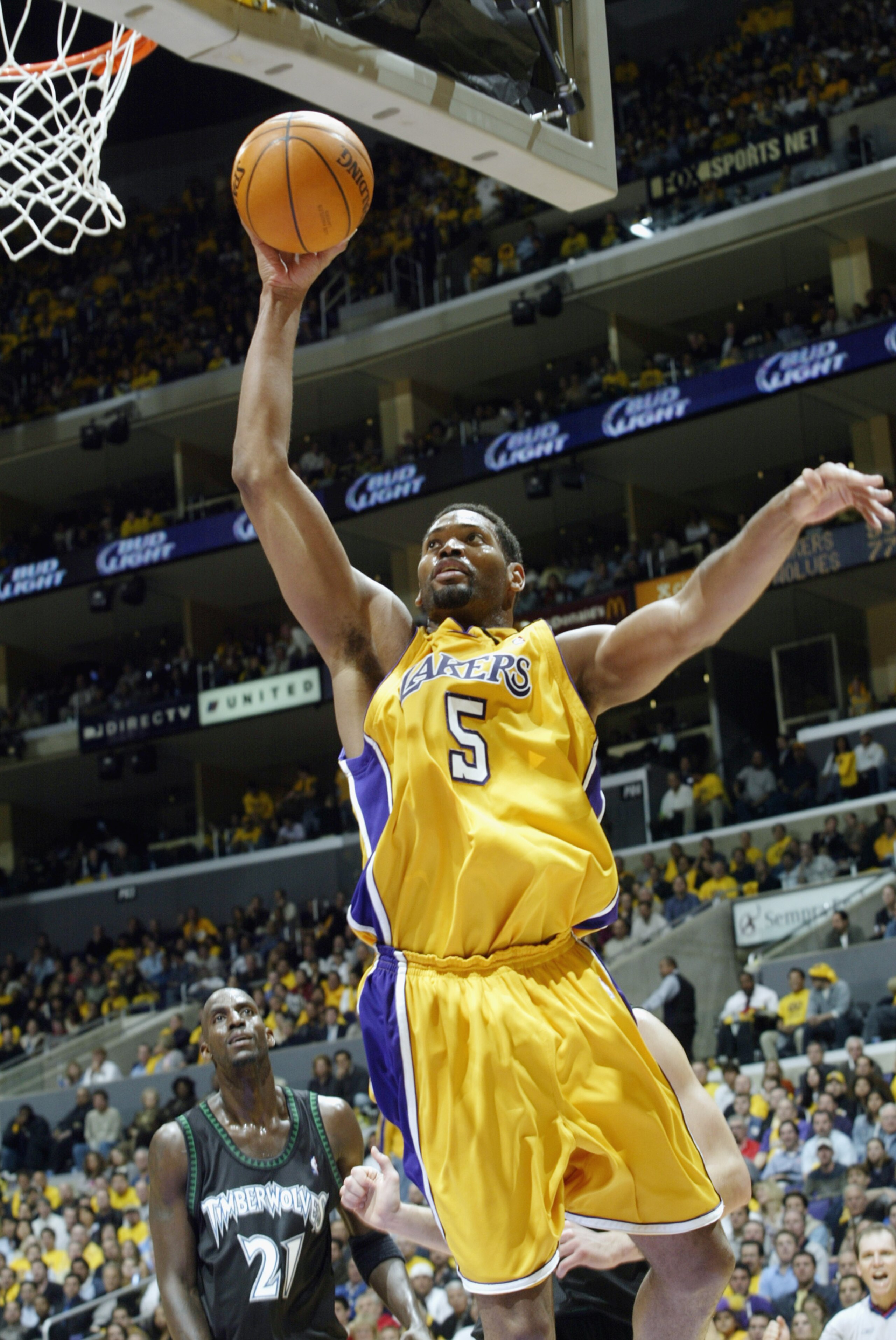 LOS ANGELES - MAY 1:  Robert Horry #5 of the Los Angeles Lakers takes the ball to the basket in Game six of the Western Conference Quarterfinals against the Minnesota Timberwolves during the 2003 NBA Playoffs at Staples Center on May 1, 2003 in Los Angele