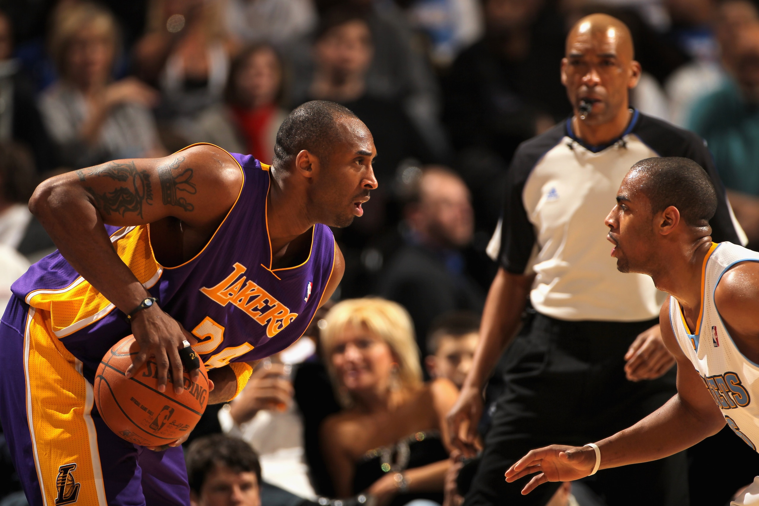 DENVER, CO - JANUARY 21:  Kobe Bryant #24 of the Los Angeles Lakers controls the ball against the defense of Arron Afflalo #6 of the Denver Nuggets at the Pepsi Center on January 21, 2011 in Denver, Colorado. The Lakers defeated the Nuggets 97-107. NOTE T