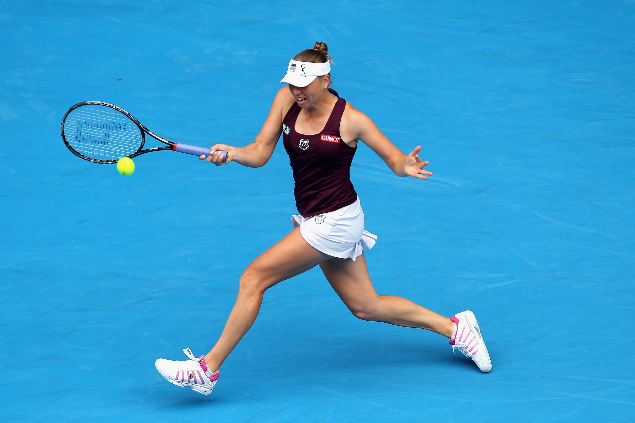 MELBOURNE, AUSTRALIA - JANUARY 26:  Vera Zvonareva of Russia plays a forehand in her quarterfinal match against Petra Kvitova of the Czech Republic during day ten of the 2011 Australian Open at Melbourne Park on January 26, 2011 in Melbourne, Australia.