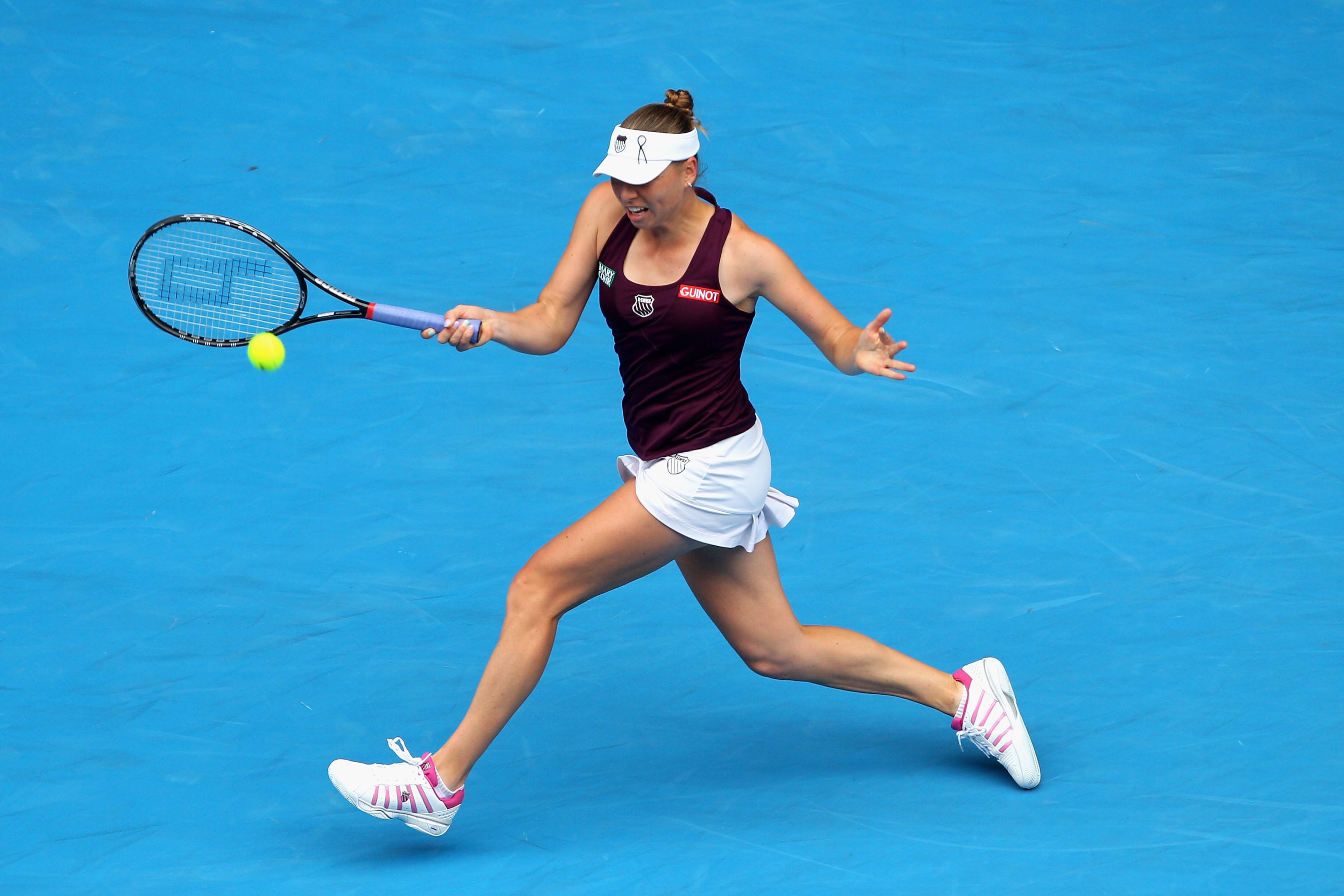 MELBOURNE, AUSTRALIA - JANUARY 26:  Vera Zvonareva of Russia plays a forehand in her quarterfinal match against Petra Kvitova of the Czech Republic during day ten of the 2011 Australian Open at Melbourne Park on January 26, 2011 in Melbourne, Australia.