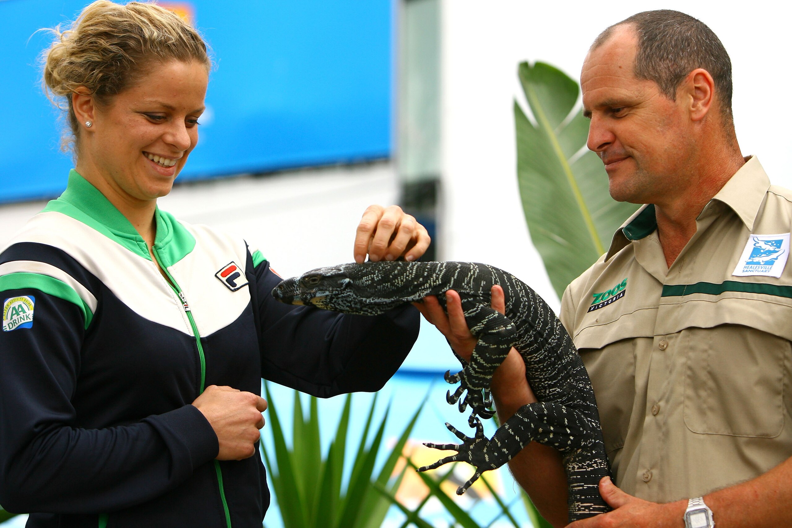 MELBOURNE, AUSTRALIA - JANUARY 26:  Kim Clijsters of Belgium poses with a goanna during day nine of the 2011 Australian Open at Melbourne Park on January 26, 2011 in Melbourne, Australia.  (Photo by Robert Prezioso/Getty Images)