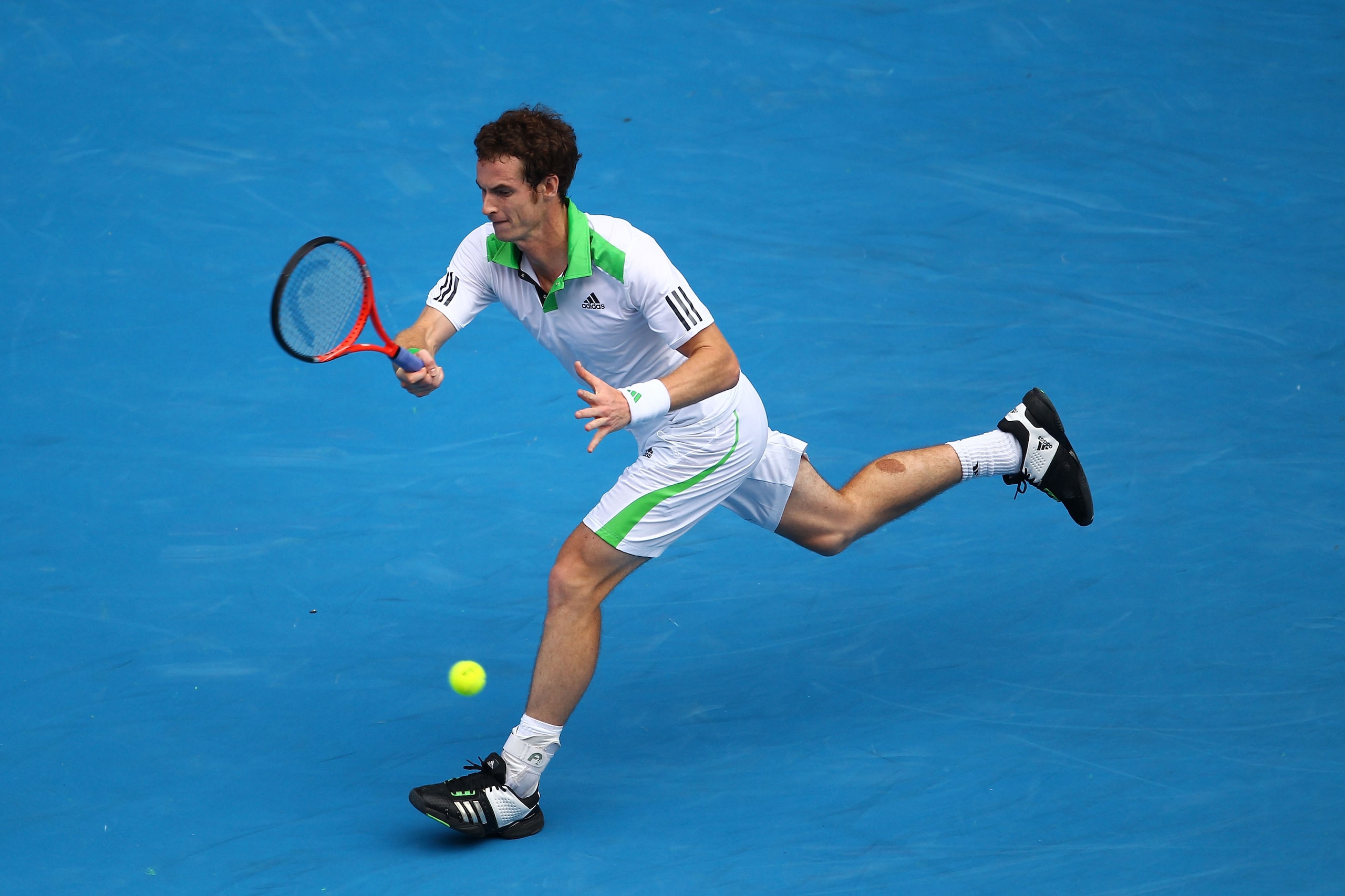 MELBOURNE, AUSTRALIA - JANUARY 26:  Andy Murray of Great Britain plays a forehand in his quarterfinal match against Alexandr Dolgopolov of the Ukraine during day ten of the 2011 Australian Open at Melbourne Park on January 26, 2011 in Melbourne, Australia