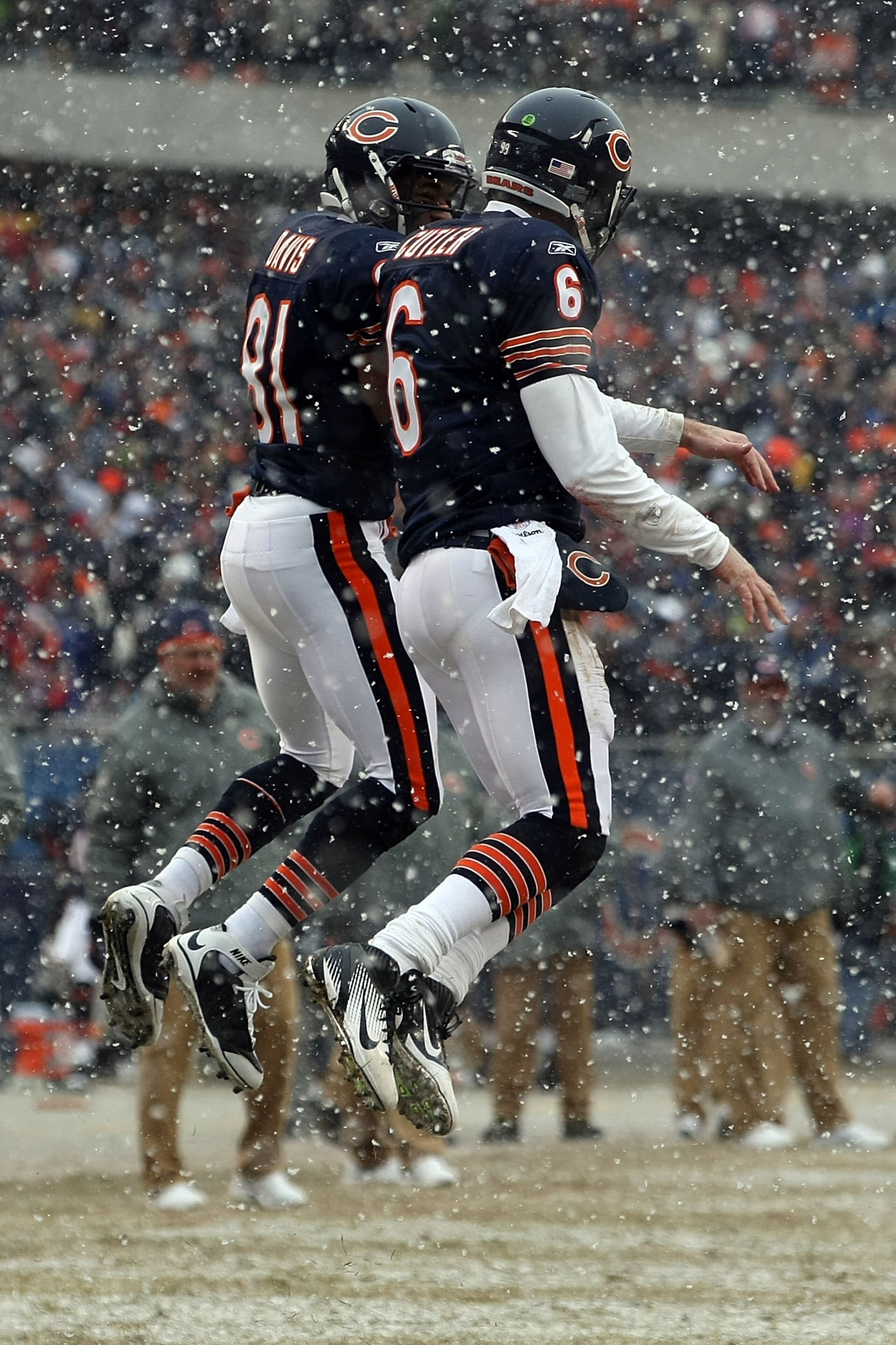 CHICAGO, IL - JANUARY 16: Quarterback Jay Cutler #6 of the Chicago Bears celebrates his six-yard touchdown run with teammate Rashied Davis #81 against the Seattle Seahawks in the second quarter of the 2011 NFC divisional playoff game at Soldier Field on CHICAGO, IL - JANUARY 16: Quarterback Jay Cutler #6 of the Chicago Bears celebrates his six-yard touchdown run with teammate Rashied Davis #81 against the Seattle Seahawks in the second quarter of the 2011 NFC divisional playoff game at Soldier Field on