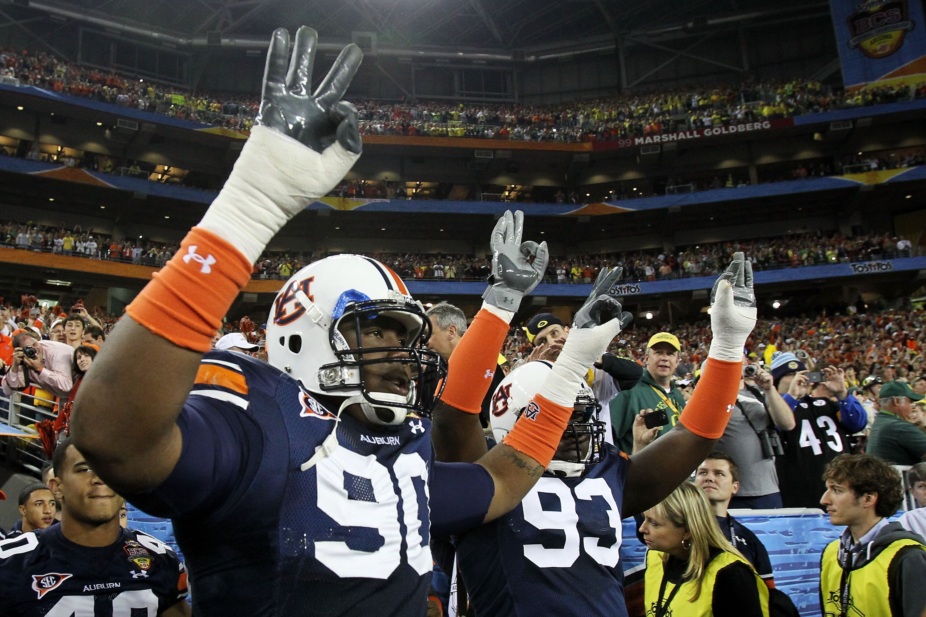 GLENDALE, AZ - JANUARY 10:  Nick Fairley #90 of the Auburn Tigers and Mike Blanc #93 of the Auburn Tigers show their support against the Oregon Ducks during the Tostitos BCS National Championship Game at University of Phoenix Stadium on January 10, 2011 i