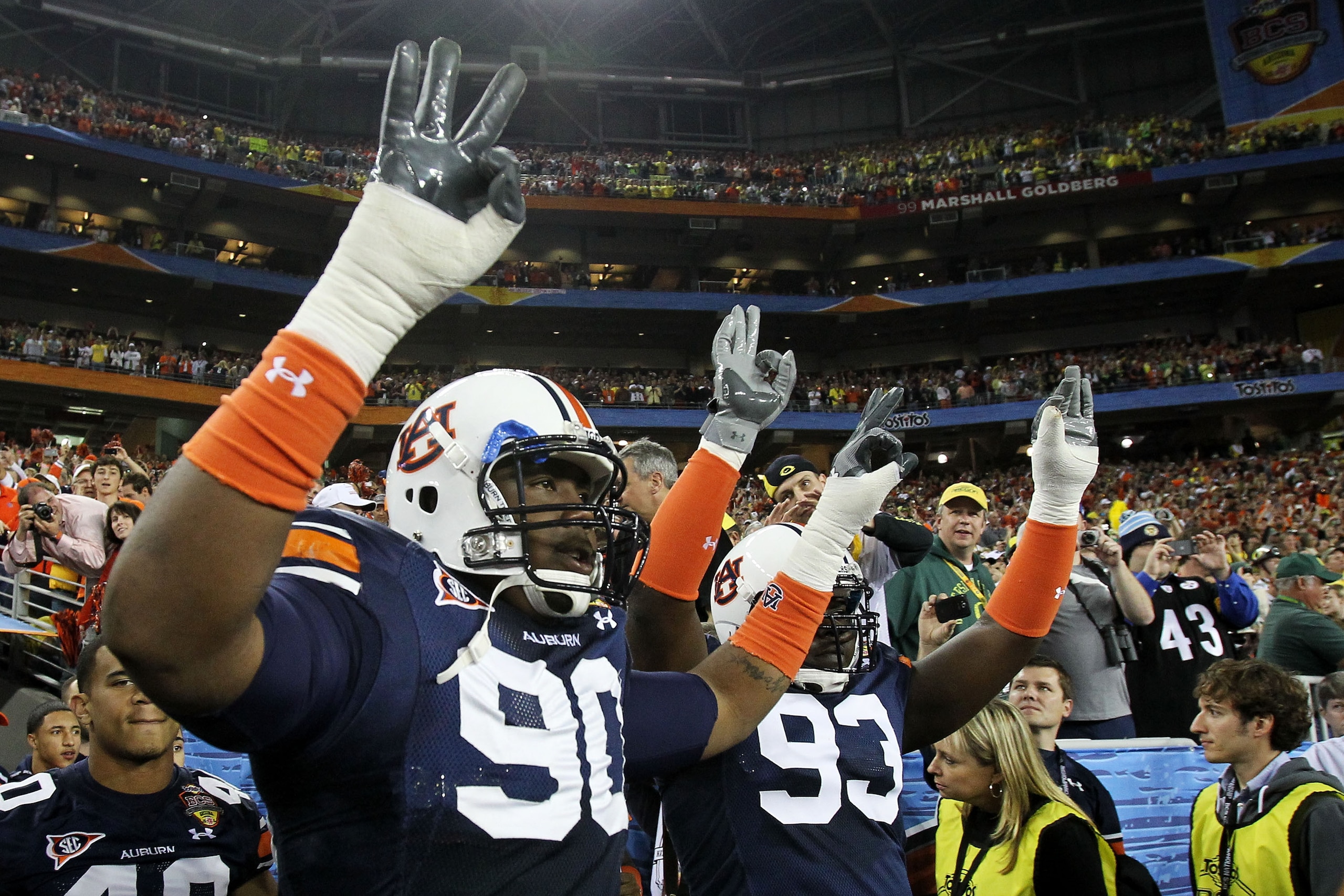 GLENDALE, AZ - JANUARY 10: Nick Fairley #90 of the Auburn Tigers and Mike Blanc #93 of the Auburn Tigers show their support against the Oregon Ducks during the Tostitos BCS National Championship Game at University of Phoenix Stadium on January 10, 2011 i GLENDALE, AZ - JANUARY 10: Nick Fairley #90 of the Auburn Tigers and Mike Blanc #93 of the Auburn Tigers show their support against the Oregon Ducks during the Tostitos BCS National Championship Game at University of Phoenix Stadium on January 10, 2011 i