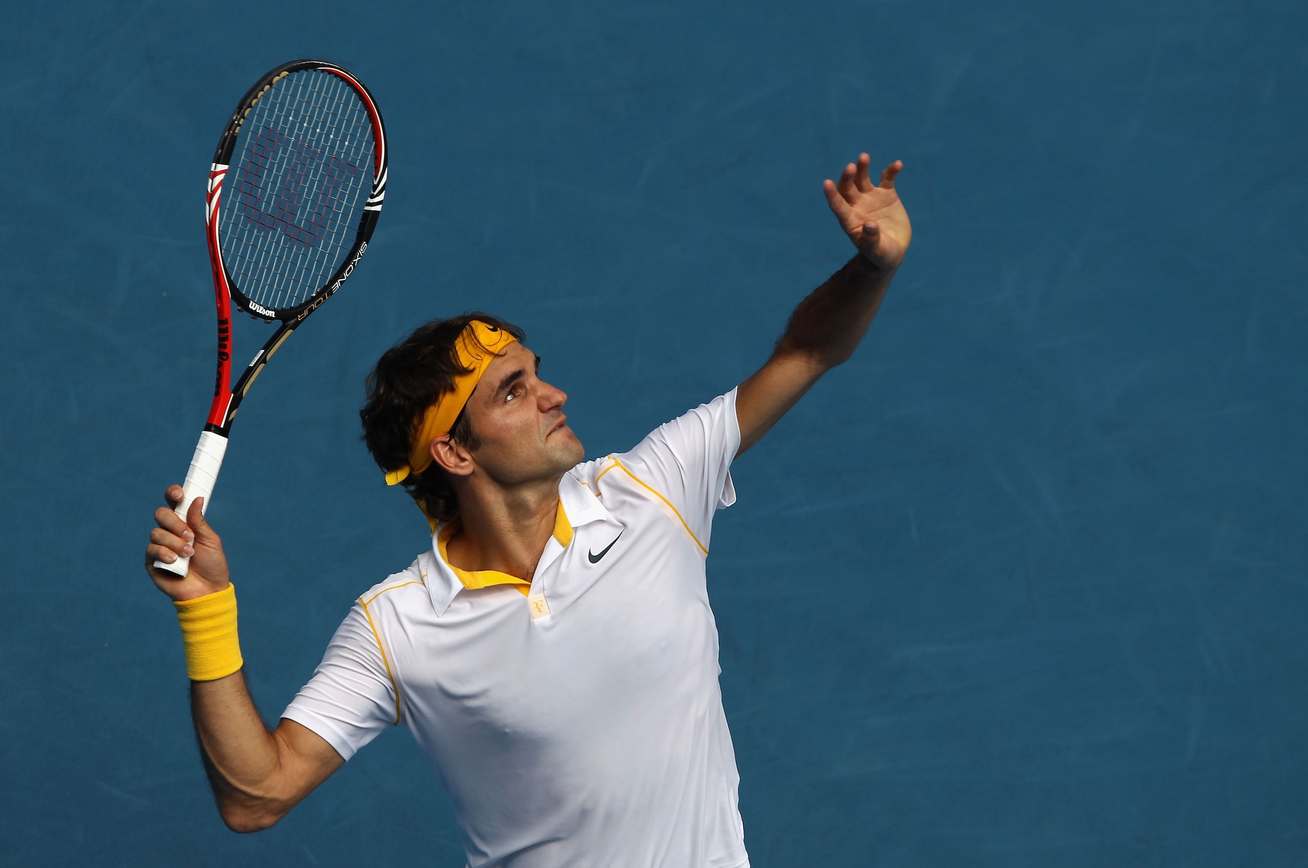 MELBOURNE, AUSTRALIA - JANUARY 25: Roger Federer of Switzerland serves in his quarterfinal match against Stanislas Wawrinka of Switzerland during day nine of the 2011 Australian Open at Melbourne Park on January 25, 2011 in Melbourne, Australia. (Photo MELBOURNE, AUSTRALIA - JANUARY 25: Roger Federer of Switzerland serves in his quarterfinal match against Stanislas Wawrinka of Switzerland during day nine of the 2011 Australian Open at Melbourne Park on January 25, 2011 in Melbourne, Australia. (Photo