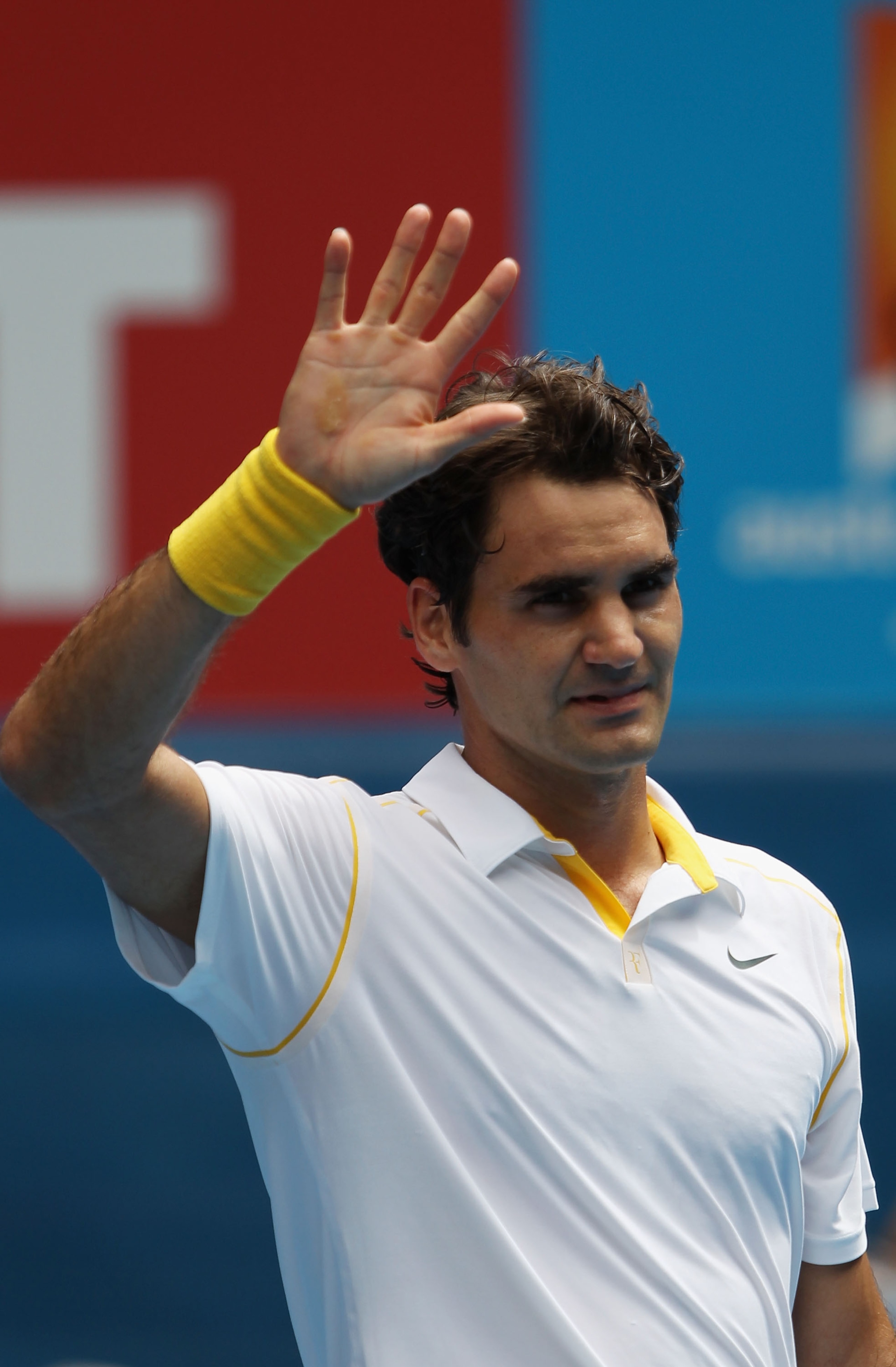 MELBOURNE, AUSTRALIA - JANUARY 25: Roger Federer of Switzerland celebrates match point in his quarterfinal match against Stanislas Wawrinka of Switzerland during day nine of the 2011 Australian Open at Melbourne Park on January 25, 2011 in Melbourne, Aus MELBOURNE, AUSTRALIA - JANUARY 25: Roger Federer of Switzerland celebrates match point in his quarterfinal match against Stanislas Wawrinka of Switzerland during day nine of the 2011 Australian Open at Melbourne Park on January 25, 2011 in Melbourne, Aus