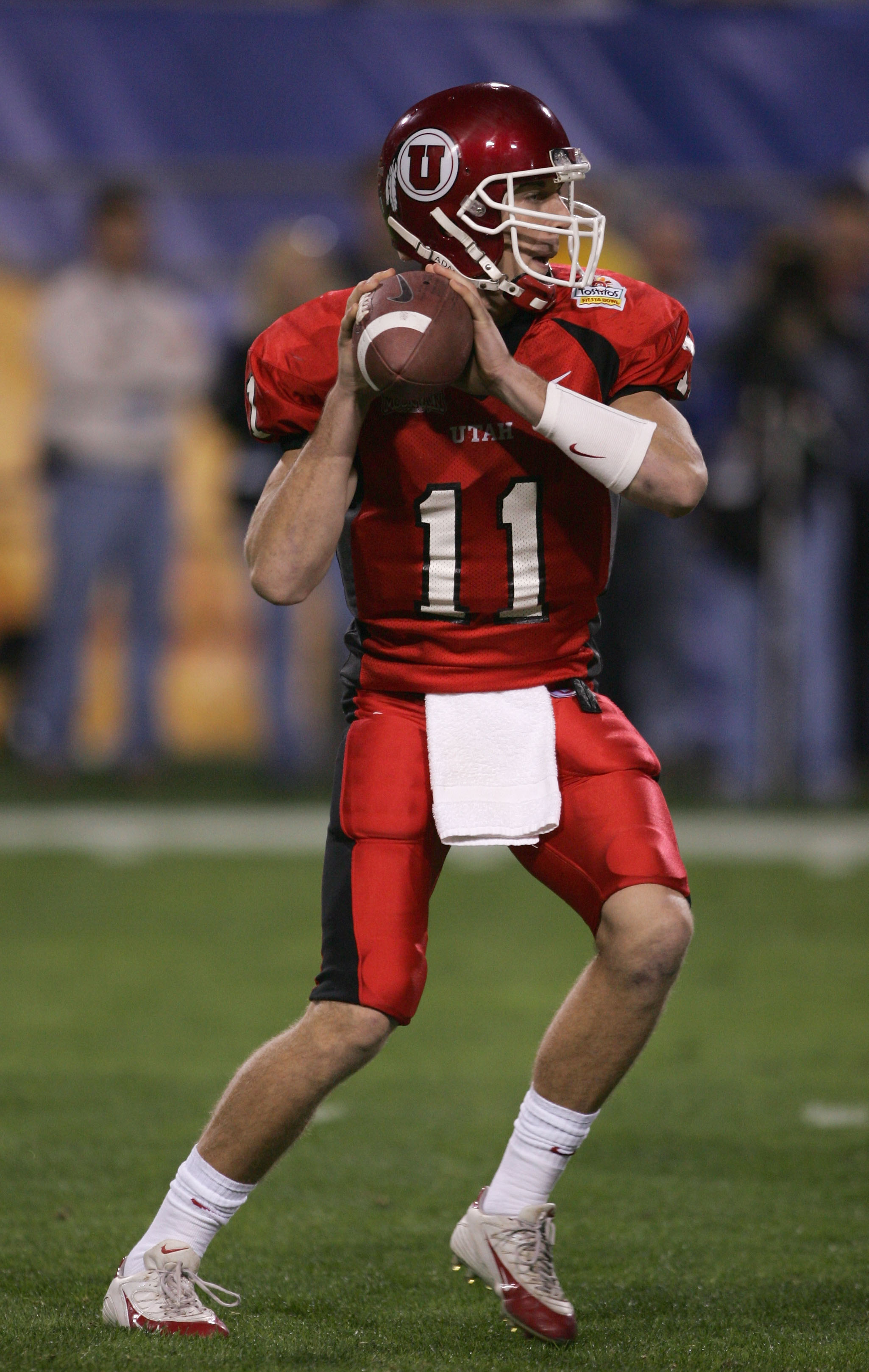 TEMPE, AZ - JANUARY 1:  Quarterback Alex Smith #11 of Utah drops back for a pass against Pittsburgh during the Tostito's Fiesta Bowl at the Sun Devil Stadium on January 1, 2005 in Tempe, Arizona. Utah won the game with the score of 35-7. (Photo by Harry H