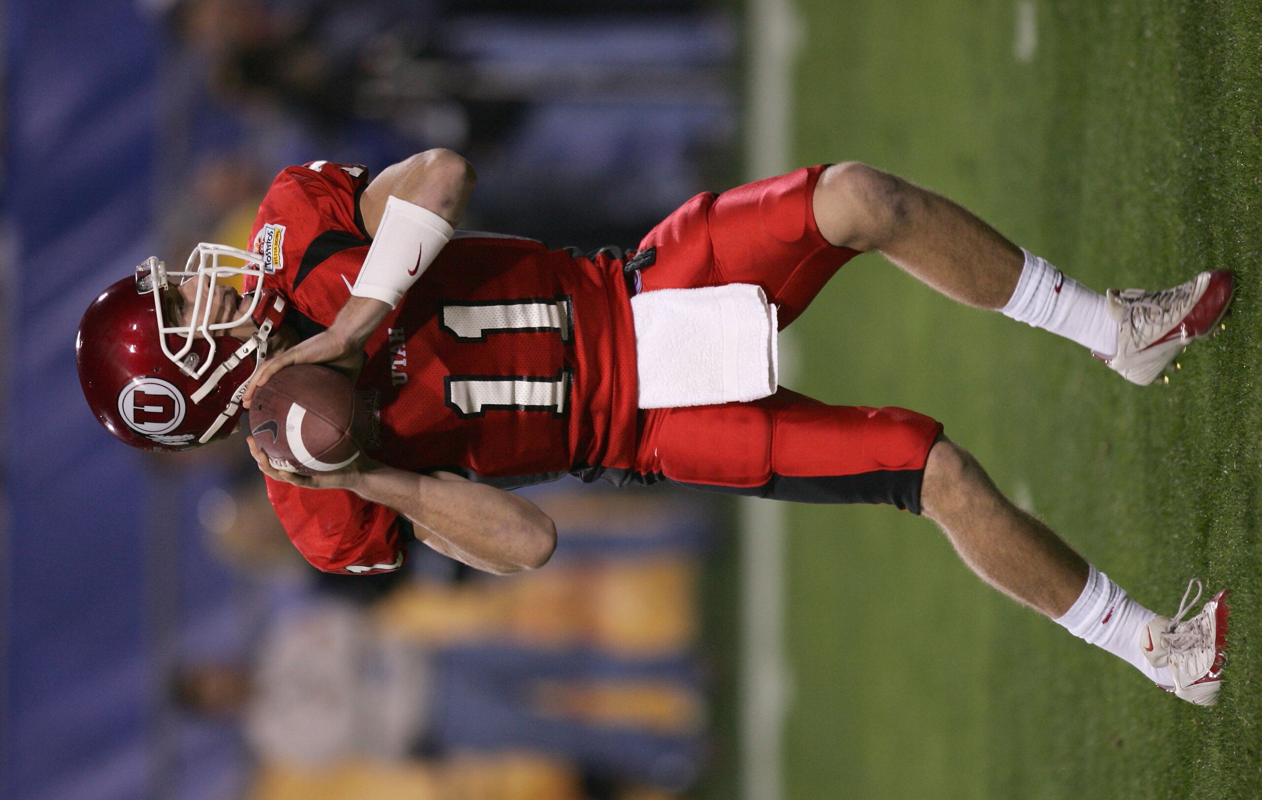 TEMPE, AZ - JANUARY 1:  Quarterback Alex Smith #11 of Utah drops back for a pass against Pittsburgh during the Tostito's Fiesta Bowl at the Sun Devil Stadium on January 1, 2005 in Tempe, Arizona. Utah won the game with the score of 35-7. (Photo by Harry H