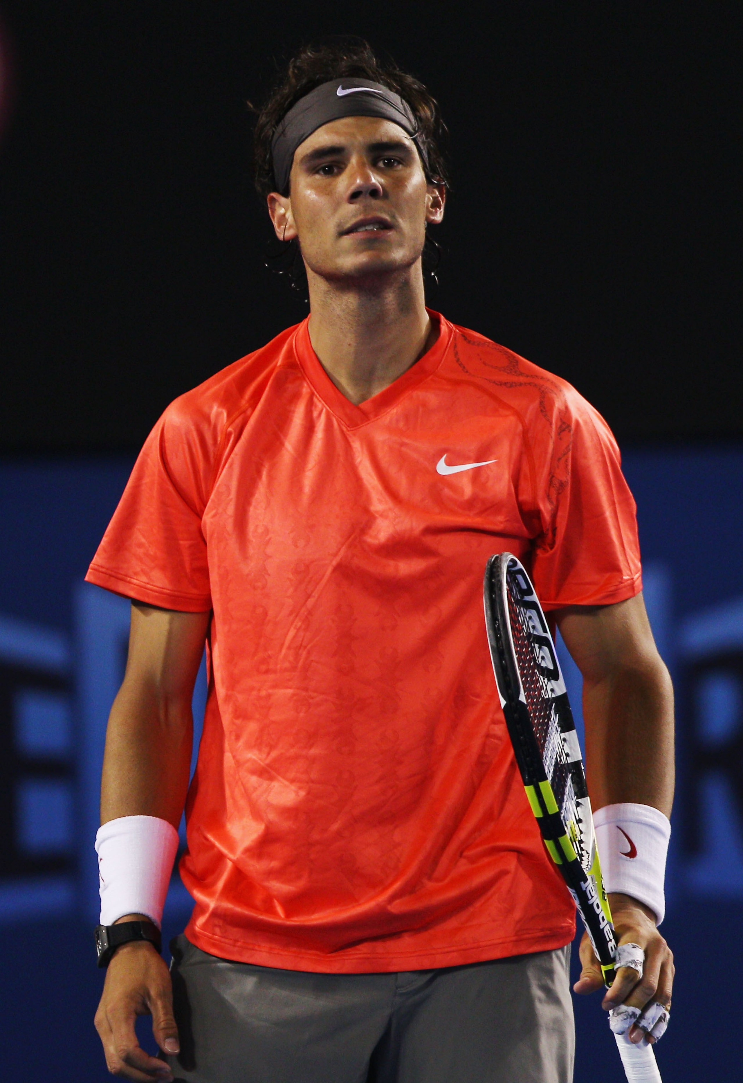 MELBOURNE, AUSTRALIA - JANUARY 24: Rafael Nadal of Spain reacts in his fourth round match against Marin Cilic of Croatia during day eight of the 2011 Australian Open at Melbourne Park on January 24, 2011 in Melbourne, Australia. (Photo by Mark Dadswell/ MELBOURNE, AUSTRALIA - JANUARY 24: Rafael Nadal of Spain reacts in his fourth round match against Marin Cilic of Croatia during day eight of the 2011 Australian Open at Melbourne Park on January 24, 2011 in Melbourne, Australia. (Photo by Mark Dadswell/