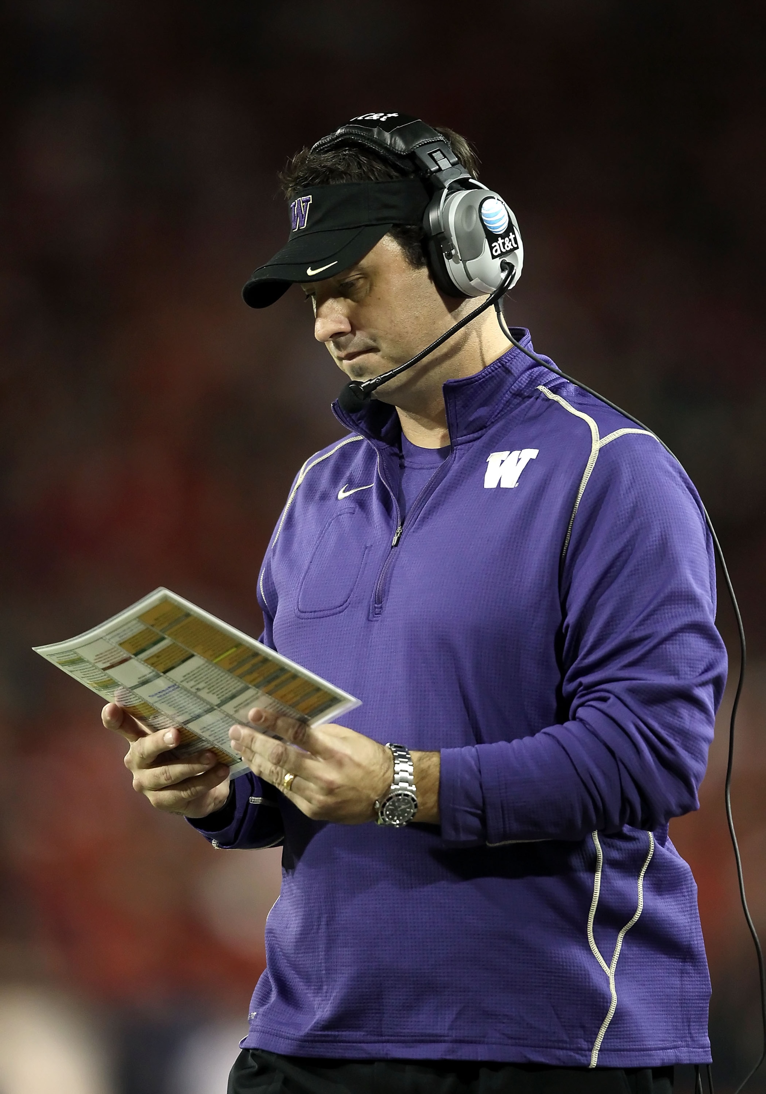 TUCSON, AZ - OCTOBER 23:  Head coach Steve Sarkisian of the Washington Huskies reviews his plays during the college football game against the Arizona Wildcats at Arizona Stadium on October 23, 2010 in Tucson, Arizona.  (Photo by Christian Petersen/Getty I
