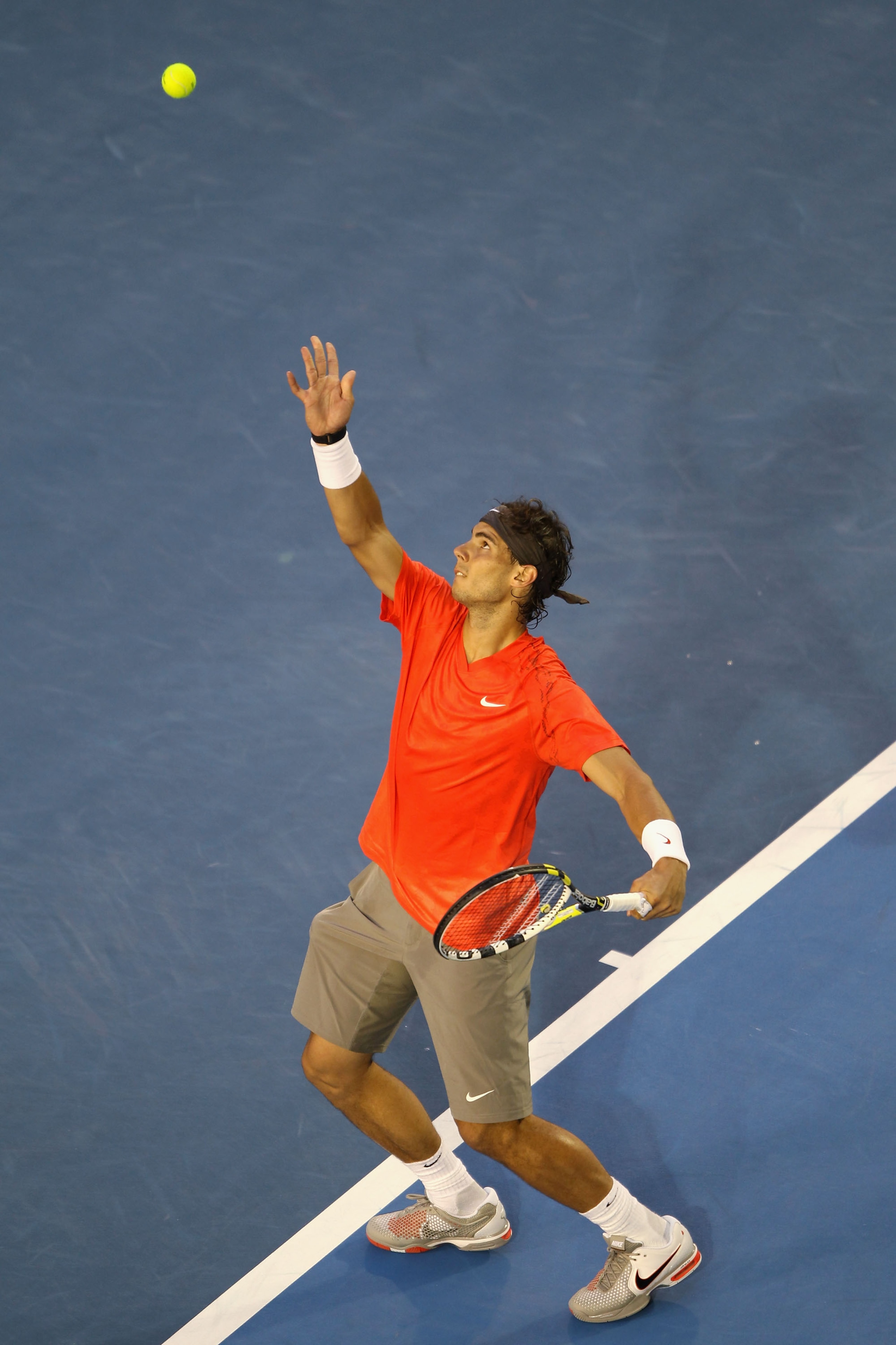 MELBOURNE, AUSTRALIA - JANUARY 26: Rafael Nadal of Spain serves in his quarterfinal match against David Ferrer of Spain during day ten of the 2011 Australian Open at Melbourne Park on January 26, 2011 in Melbourne, Australia. (Photo by Clive Brunskill/G MELBOURNE, AUSTRALIA - JANUARY 26: Rafael Nadal of Spain serves in his quarterfinal match against David Ferrer of Spain during day ten of the 2011 Australian Open at Melbourne Park on January 26, 2011 in Melbourne, Australia. (Photo by Clive Brunskill/G