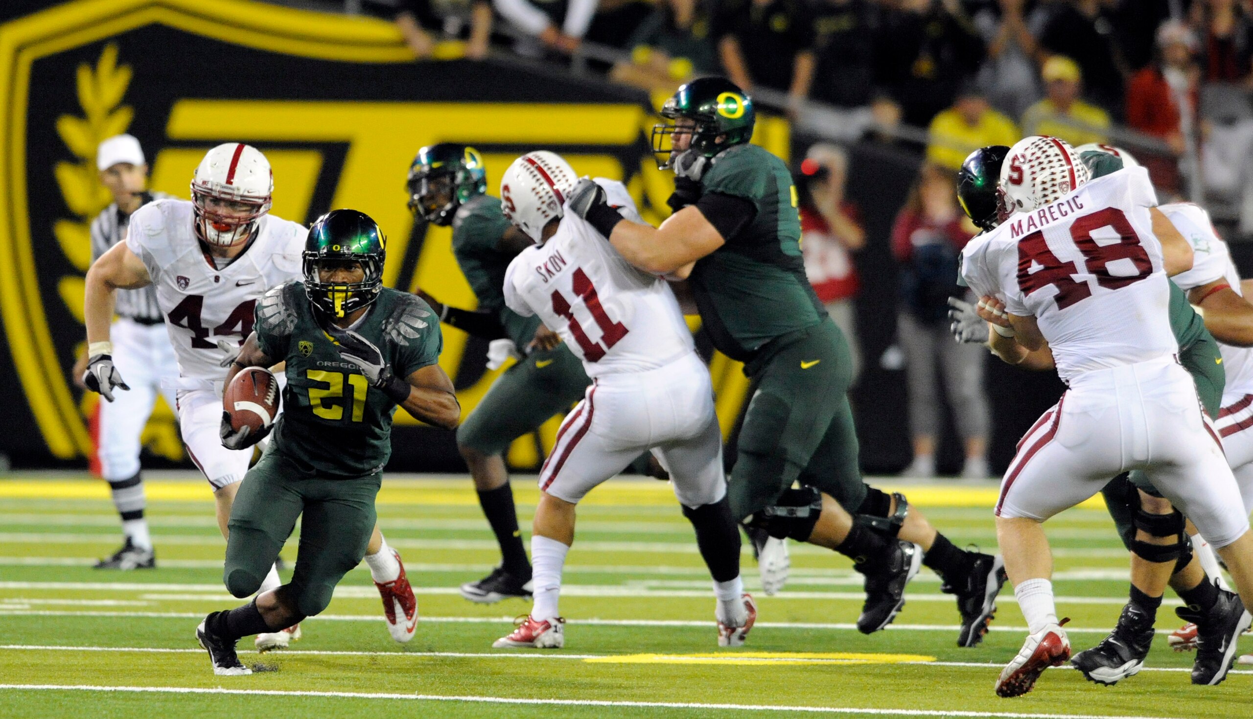 EUGENE, OR - OCTOBER 2: Running back LaMichael James #21 of the Oregon Ducks breaks into the open as linebacker Chase Thomas #44, linebacker Shane Skov #11 and linebacker Owen Merecic #48 of the Stanford Cardinal try to catch him during the third quarter EUGENE, OR - OCTOBER 2: Running back LaMichael James #21 of the Oregon Ducks breaks into the open as linebacker Chase Thomas #44, linebacker Shane Skov #11 and linebacker Owen Merecic #48 of the Stanford Cardinal try to catch him during the third quarter