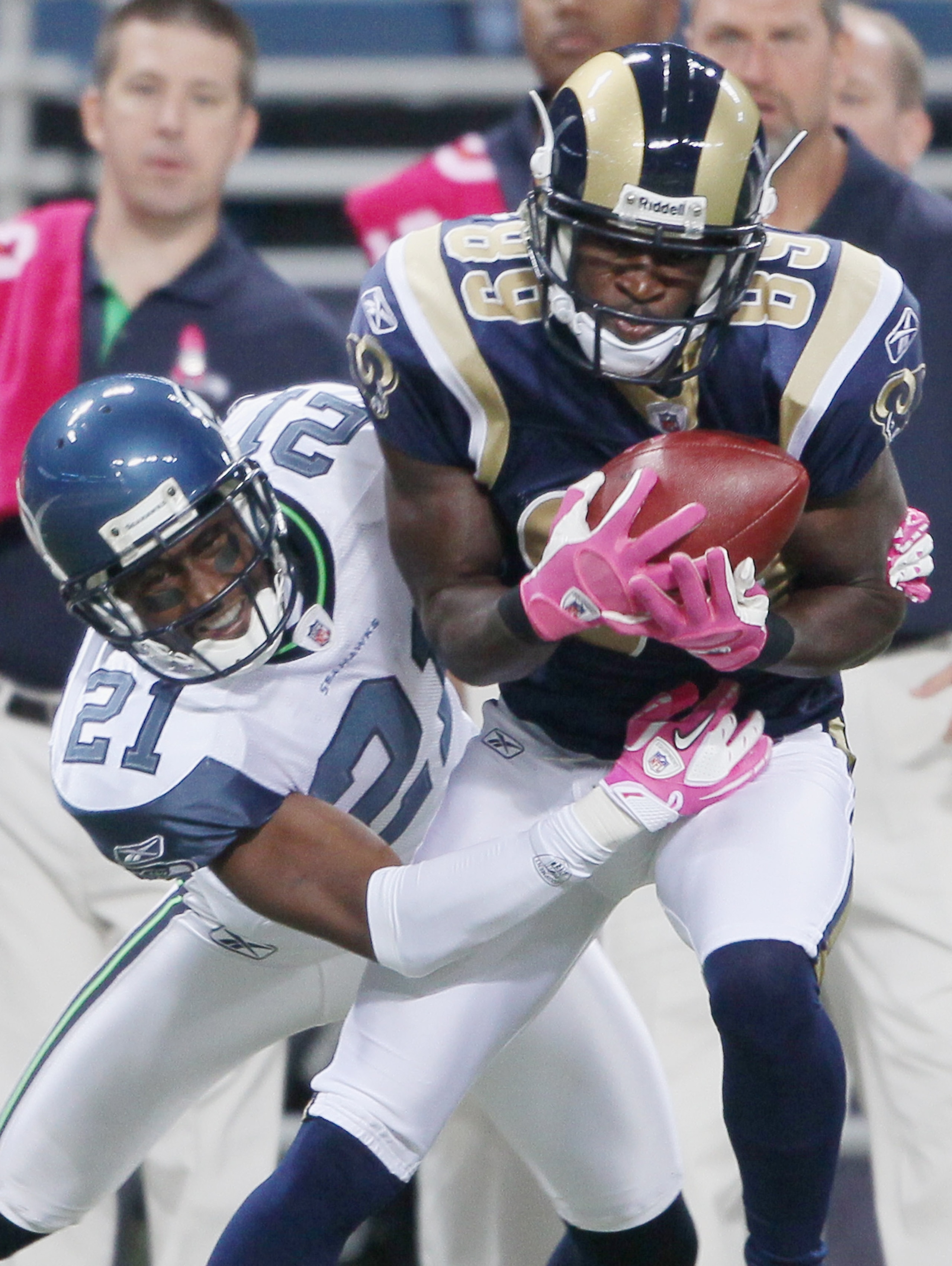 ST. LOUIS - OCTOBER 03:  Mark Clayton #89 of the St. Louis Rams catches the ball as Kelly Jennings #21 of the Seattle Seahawks on October 3, 2010 at Edward Jones Dome in St. Louis, Missouri.  (Photo by Elsa/Getty Images)