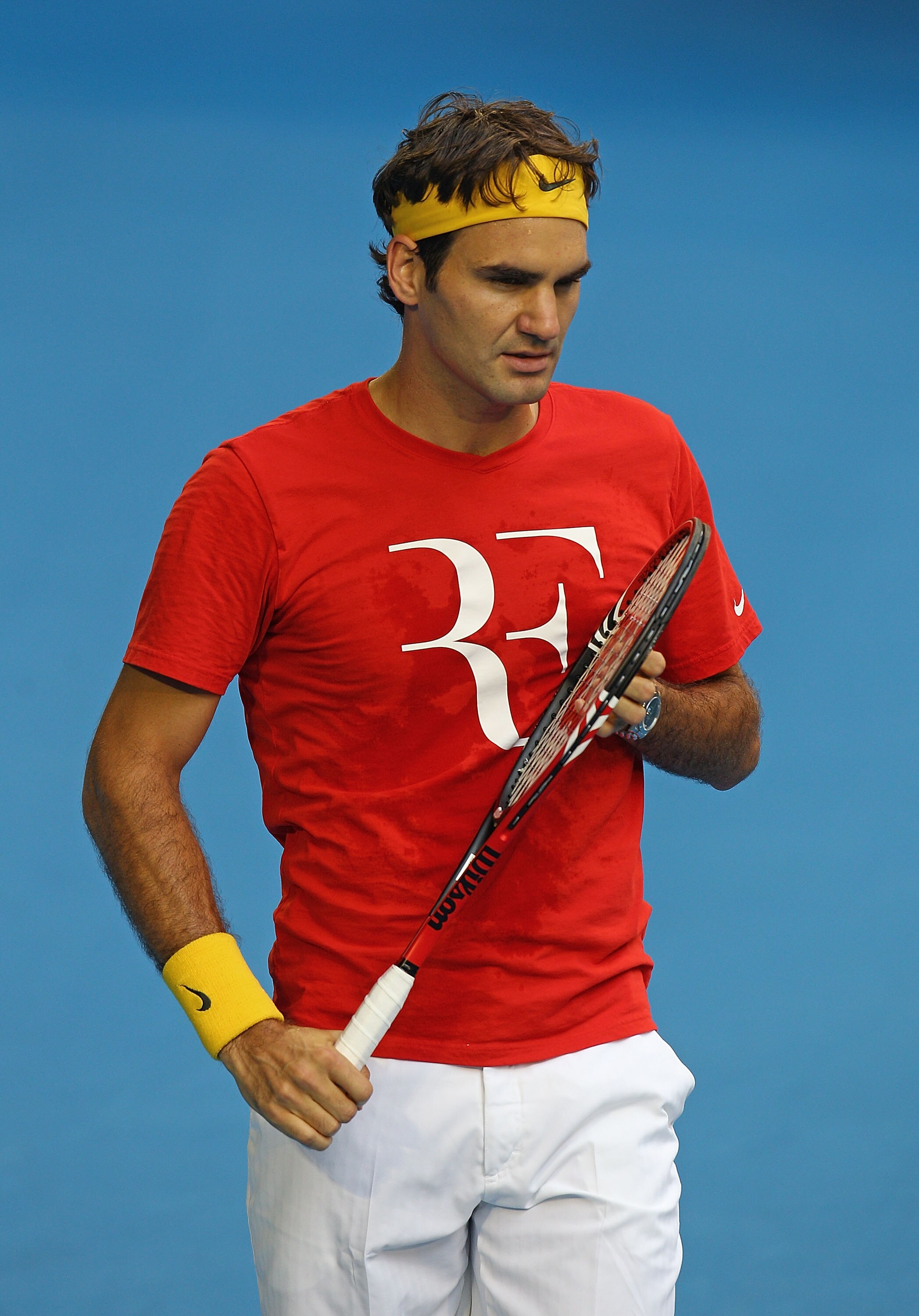MELBOURNE, AUSTRALIA - JANUARY 12:  Roger Federer of Switzerland looks on during a practice session ahead of the 2011 Australian Open at Melbourne Park on January 12, 2011 in Melbourne, Australia.  (Photo by Scott Barbour/Getty Images)
