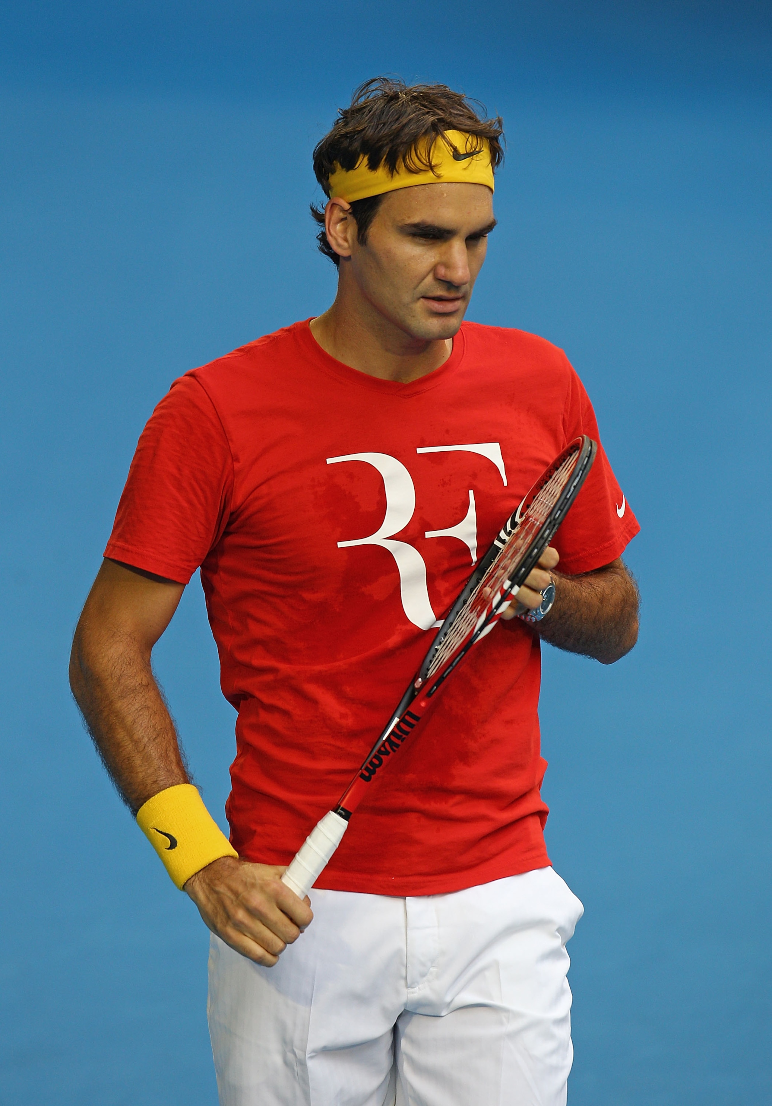 MELBOURNE, AUSTRALIA - JANUARY 12: Roger Federer of Switzerland looks on during a practice session ahead of the 2011 Australian Open at Melbourne Park on January 12, 2011 in Melbourne, Australia. (Photo by Scott Barbour/Getty Images) MELBOURNE, AUSTRALIA - JANUARY 12: Roger Federer of Switzerland looks on during a practice session ahead of the 2011 Australian Open at Melbourne Park on January 12, 2011 in Melbourne, Australia. (Photo by Scott Barbour/Getty Images)