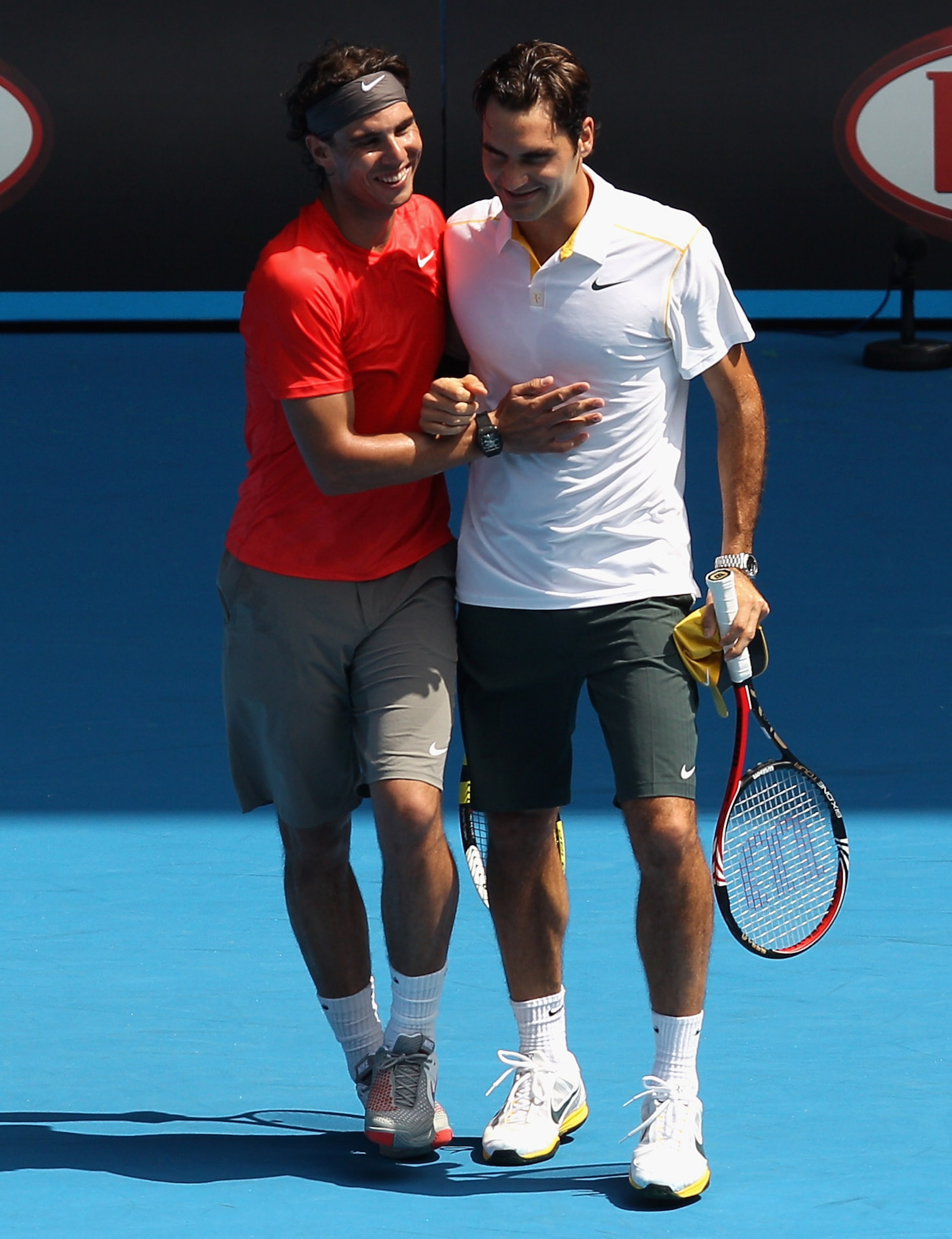 MELBOURNE, AUSTRALIA - JANUARY 16: Rafael Nadal of Spain and Roger Federer of Switzerland celebrate a point during the 'Rally For Relief' charity exhibition match ahead of the 2011 Australian Open at Melbourne Park on January 16, 2011 in Melbourne, Austr MELBOURNE, AUSTRALIA - JANUARY 16: Rafael Nadal of Spain and Roger Federer of Switzerland celebrate a point during the 'Rally For Relief' charity exhibition match ahead of the 2011 Australian Open at Melbourne Park on January 16, 2011 in Melbourne, Austr